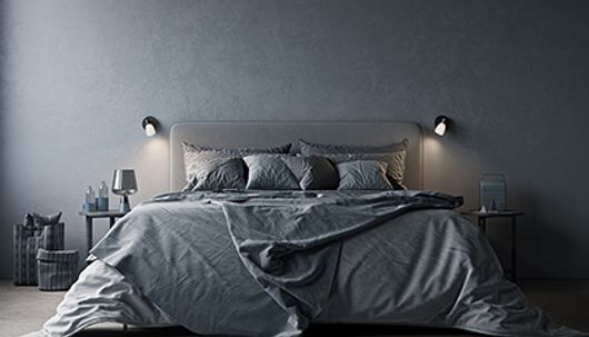 Cut wall lamp in black from Herstal.