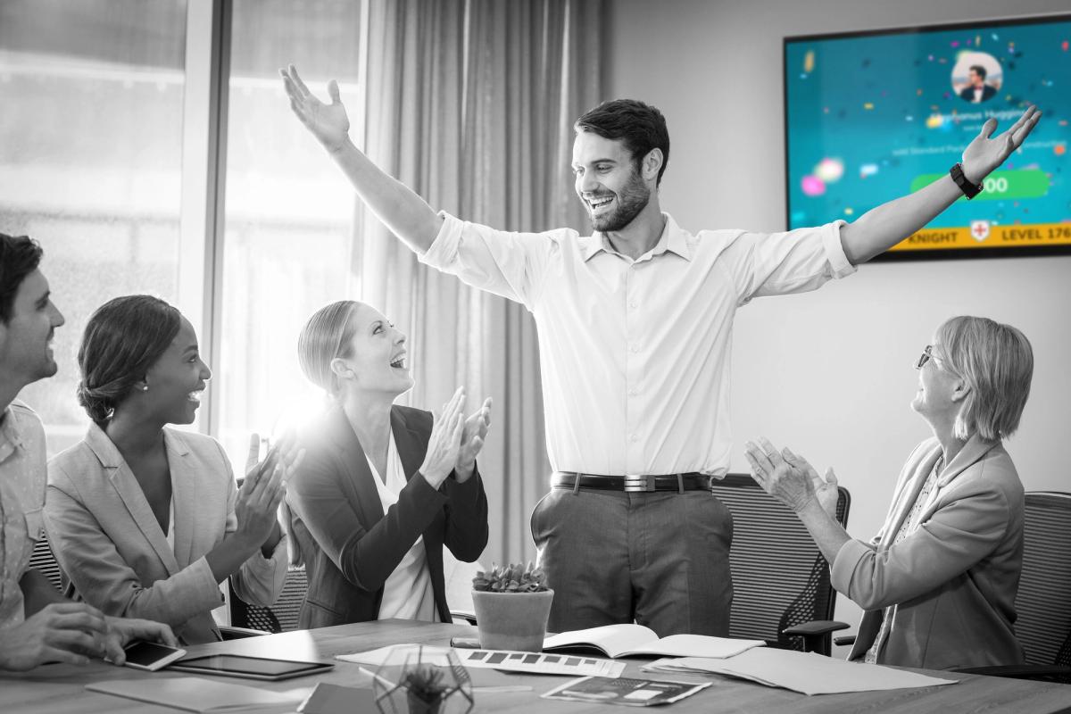 Man celebrating infront of screen