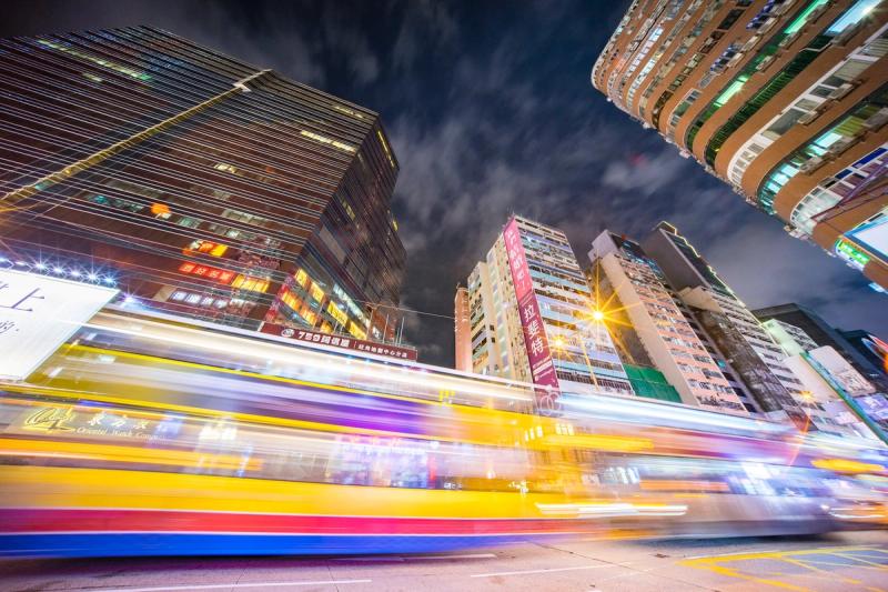 Speeding cars at night in Hong Kong (Photo by Jimmy Chan: https://www.pexels.com/photo/time-lapse-photography-of-road-near-buildings-2552595/)