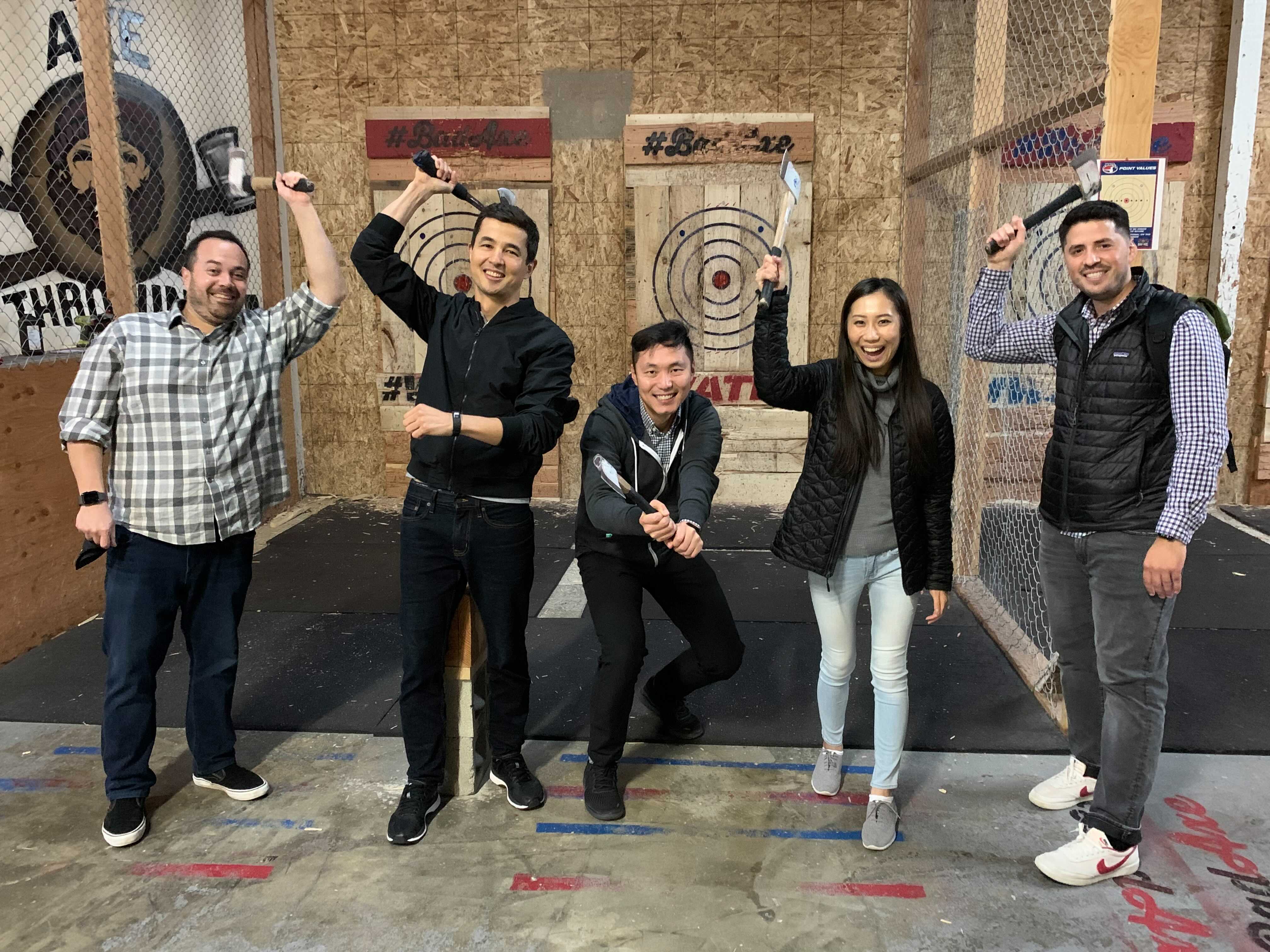 Pictures of employees throwing axes.