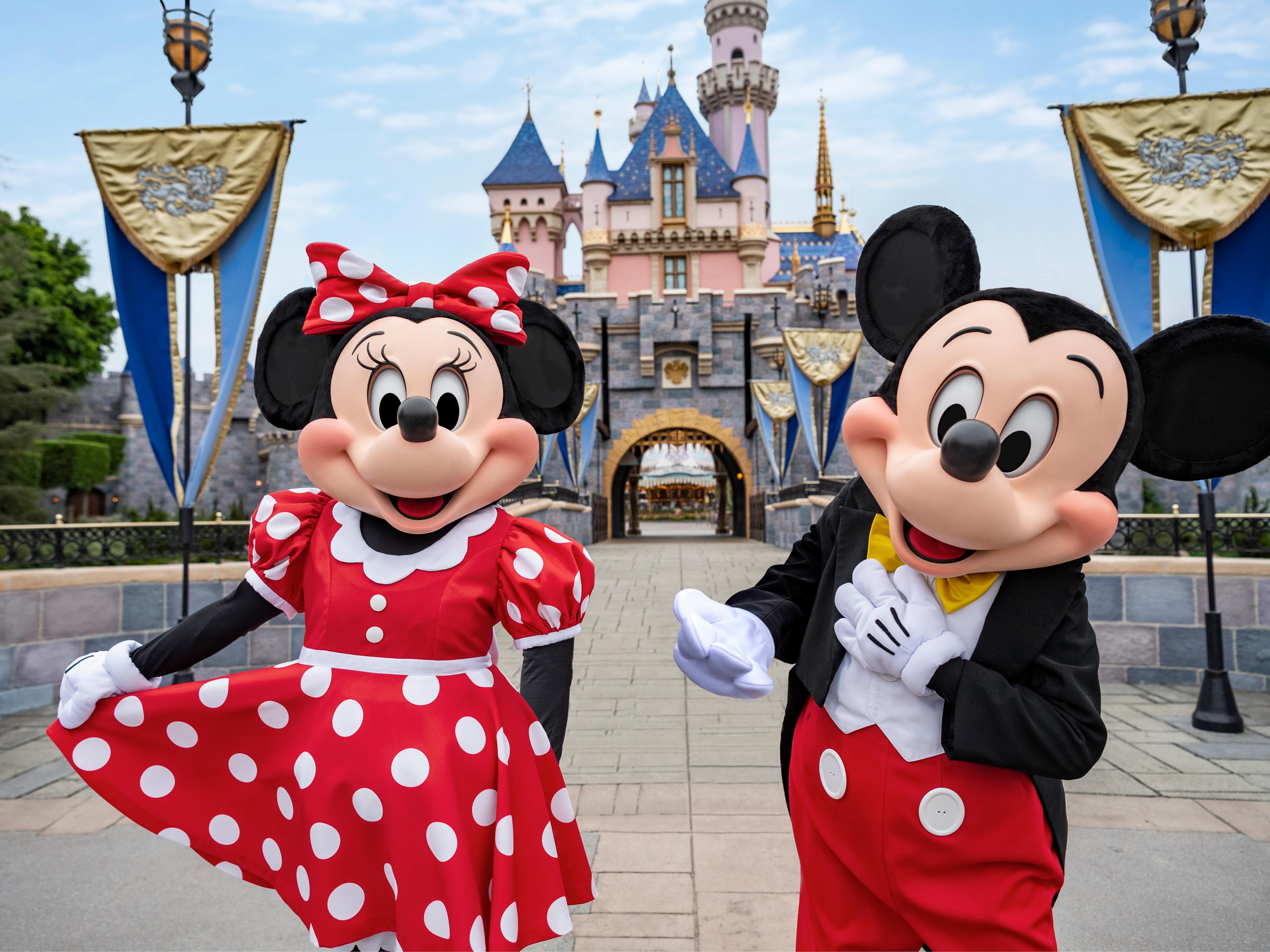 Mickey and Minnie in front of castle at Disneyland