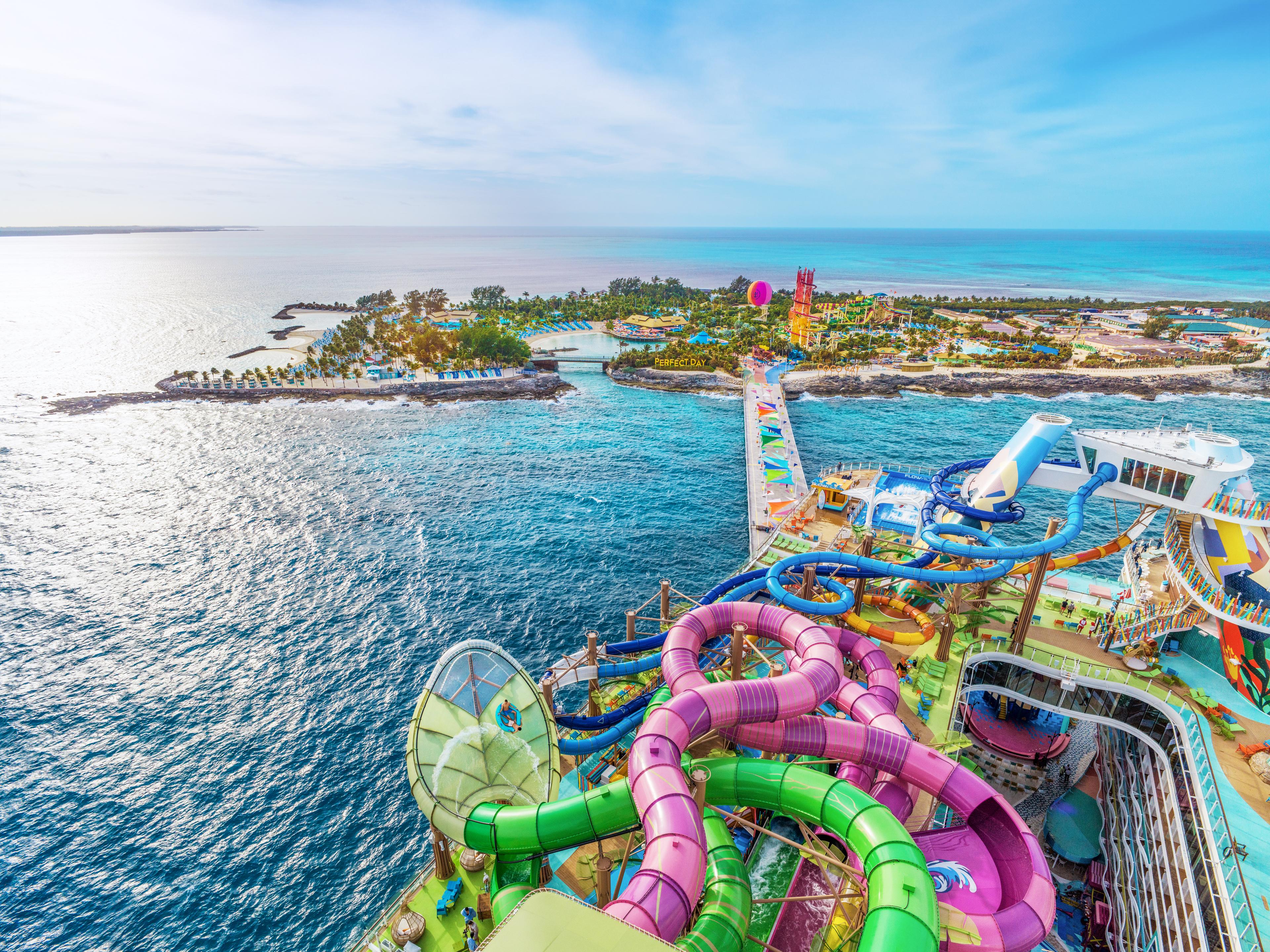 A Royal Caribbean ship with slides and walkway to island