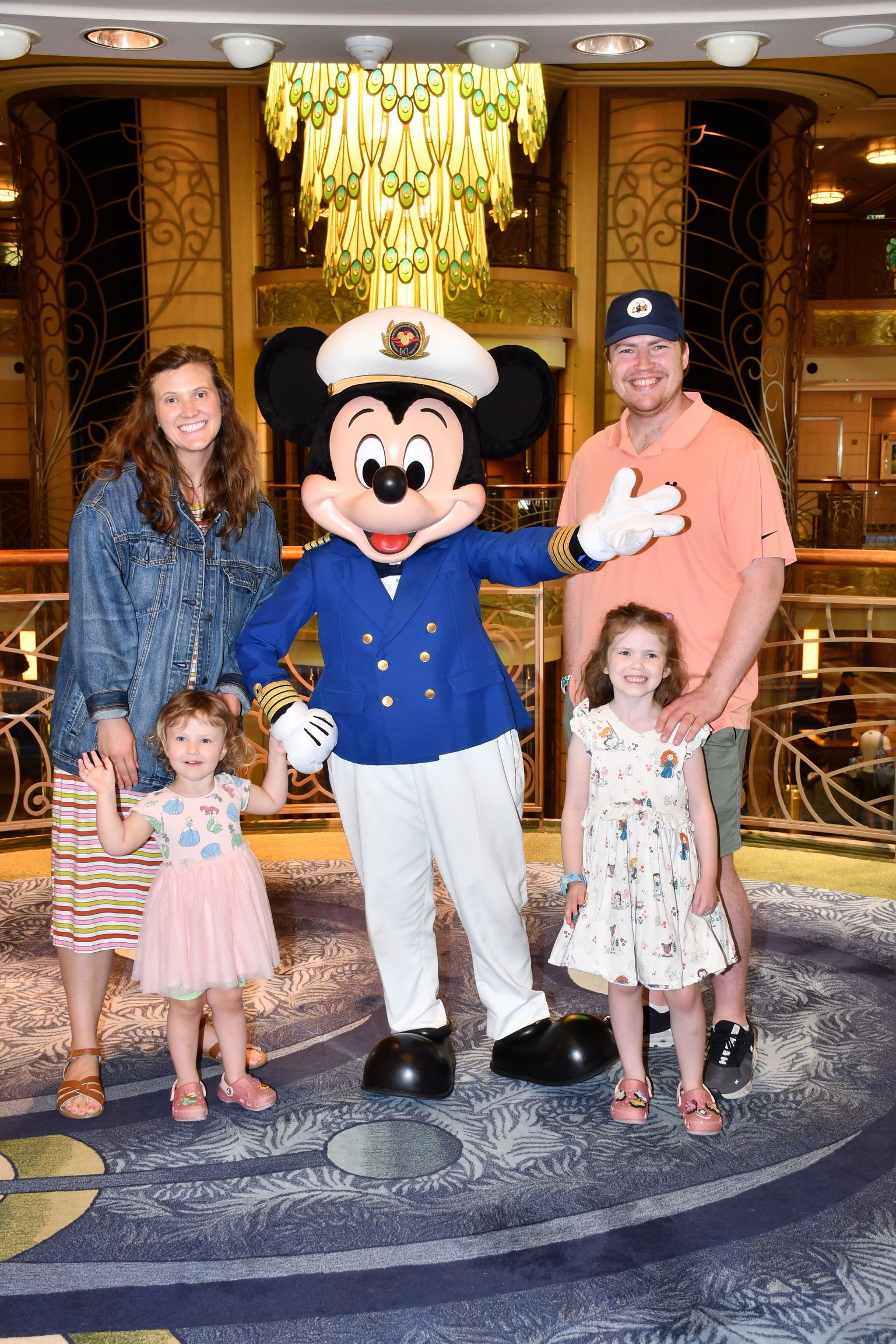 Lindsay Peters and family with captain Mickey on a cruise ship