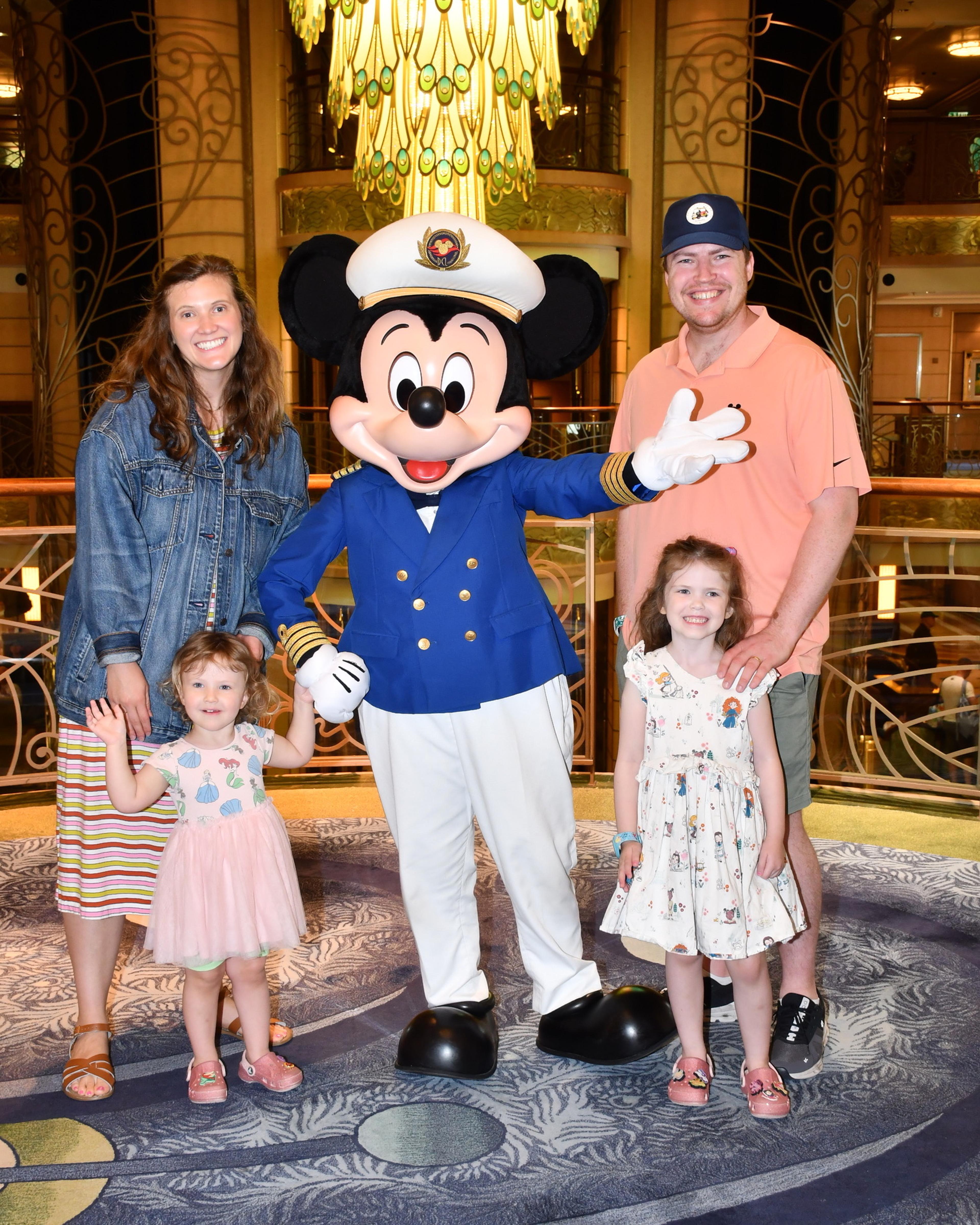 Lindsay Peters and family with captain Mickey on a cruise ship