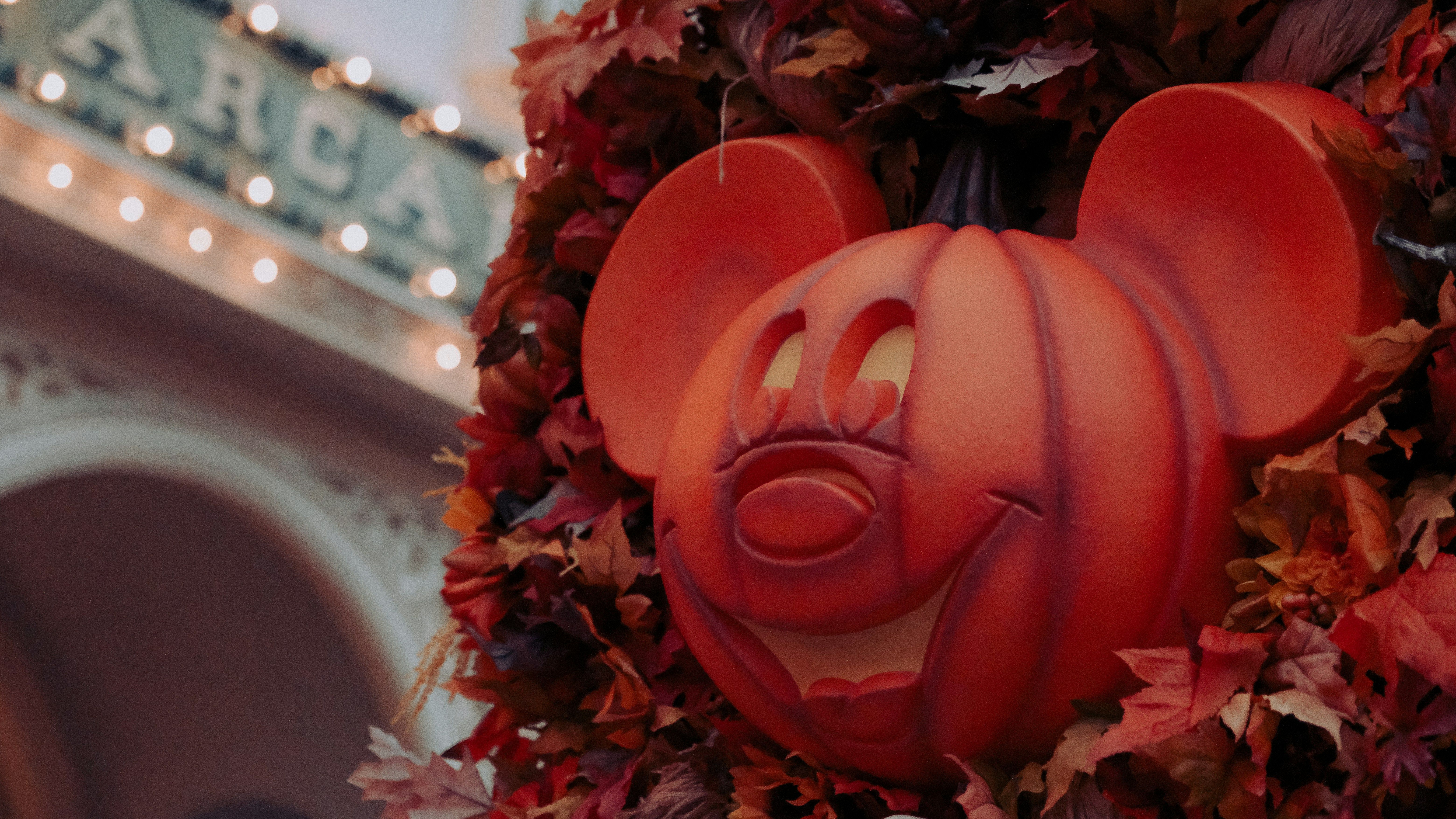 Pumpkin Mickeys in fall garland in Magic Kingdom