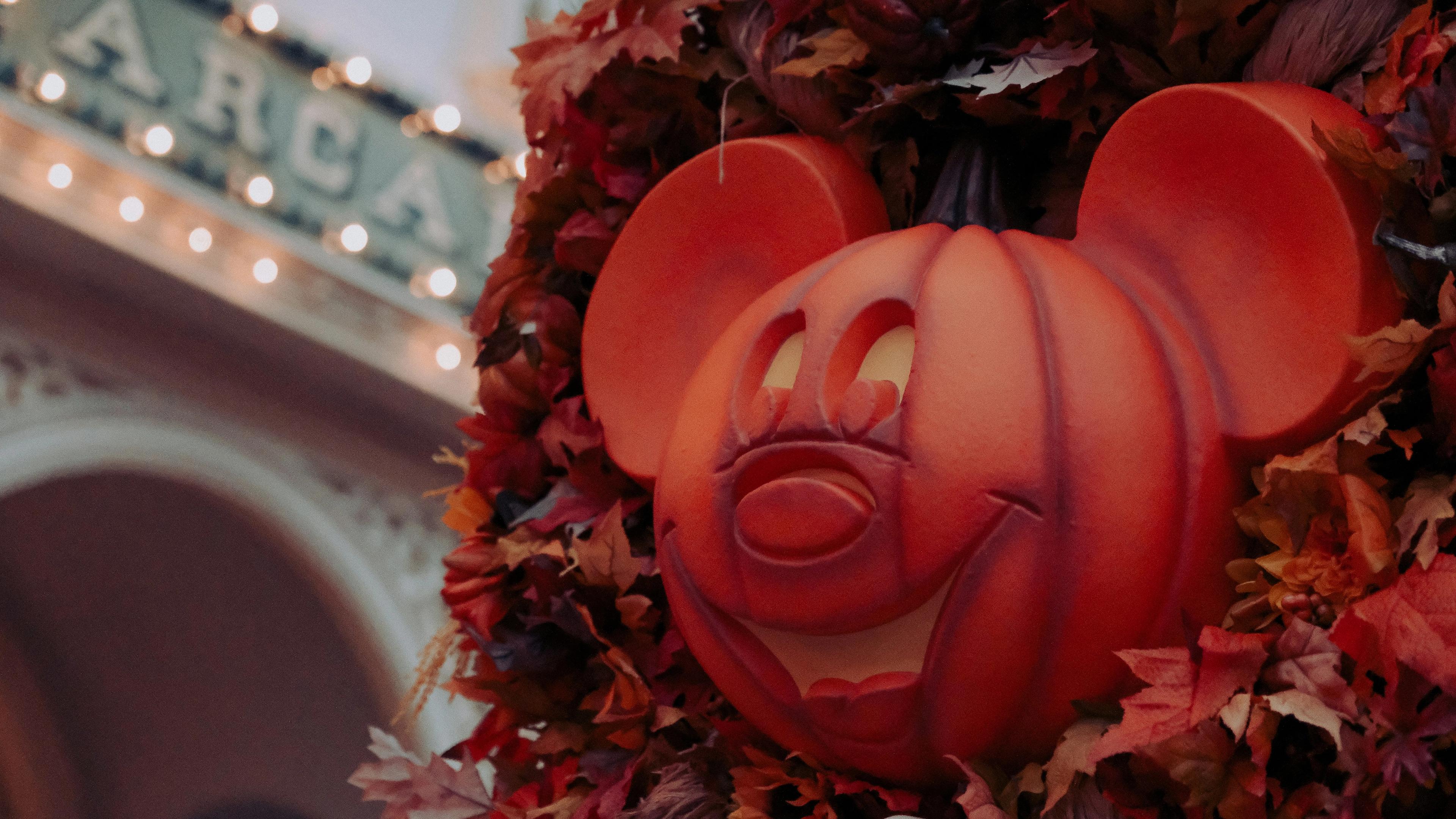 Pumpkin Mickeys in fall garland in Magic Kingdom