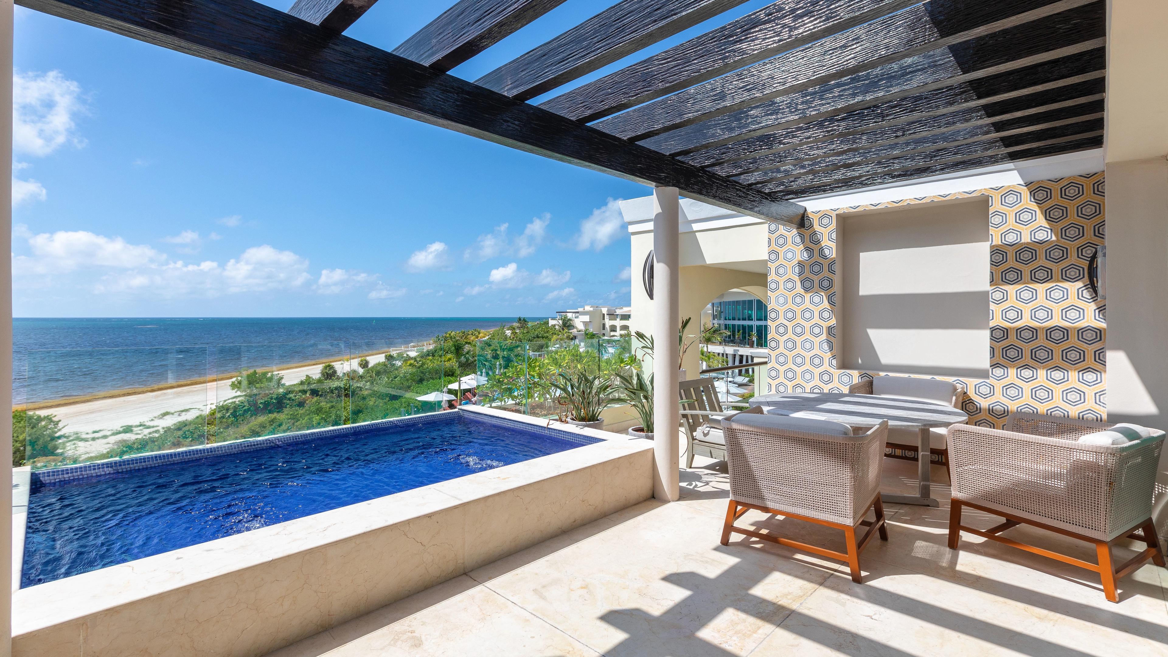 A private plunge pool and patio at a beach-front resort