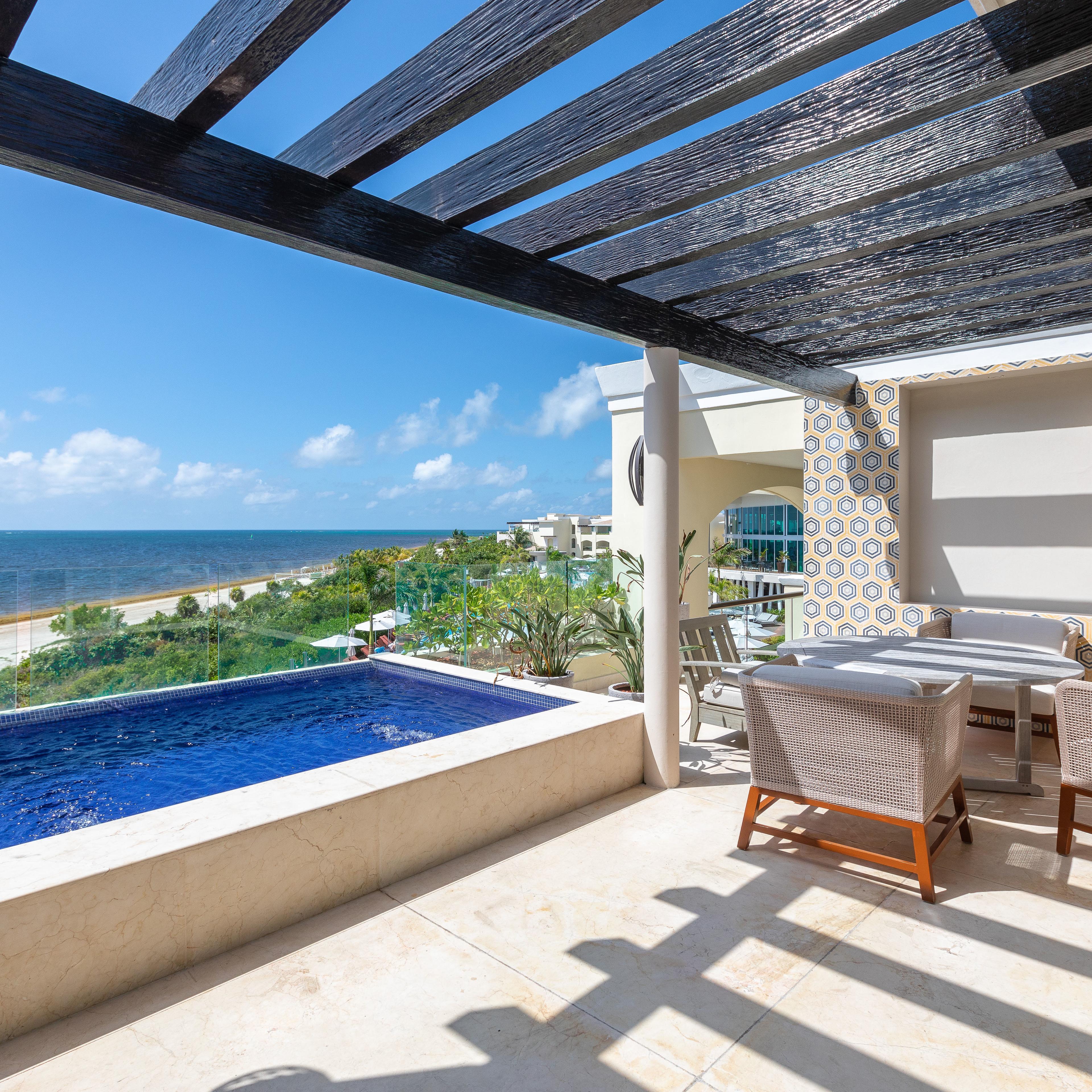 A private plunge pool and patio at a beach-front resort
