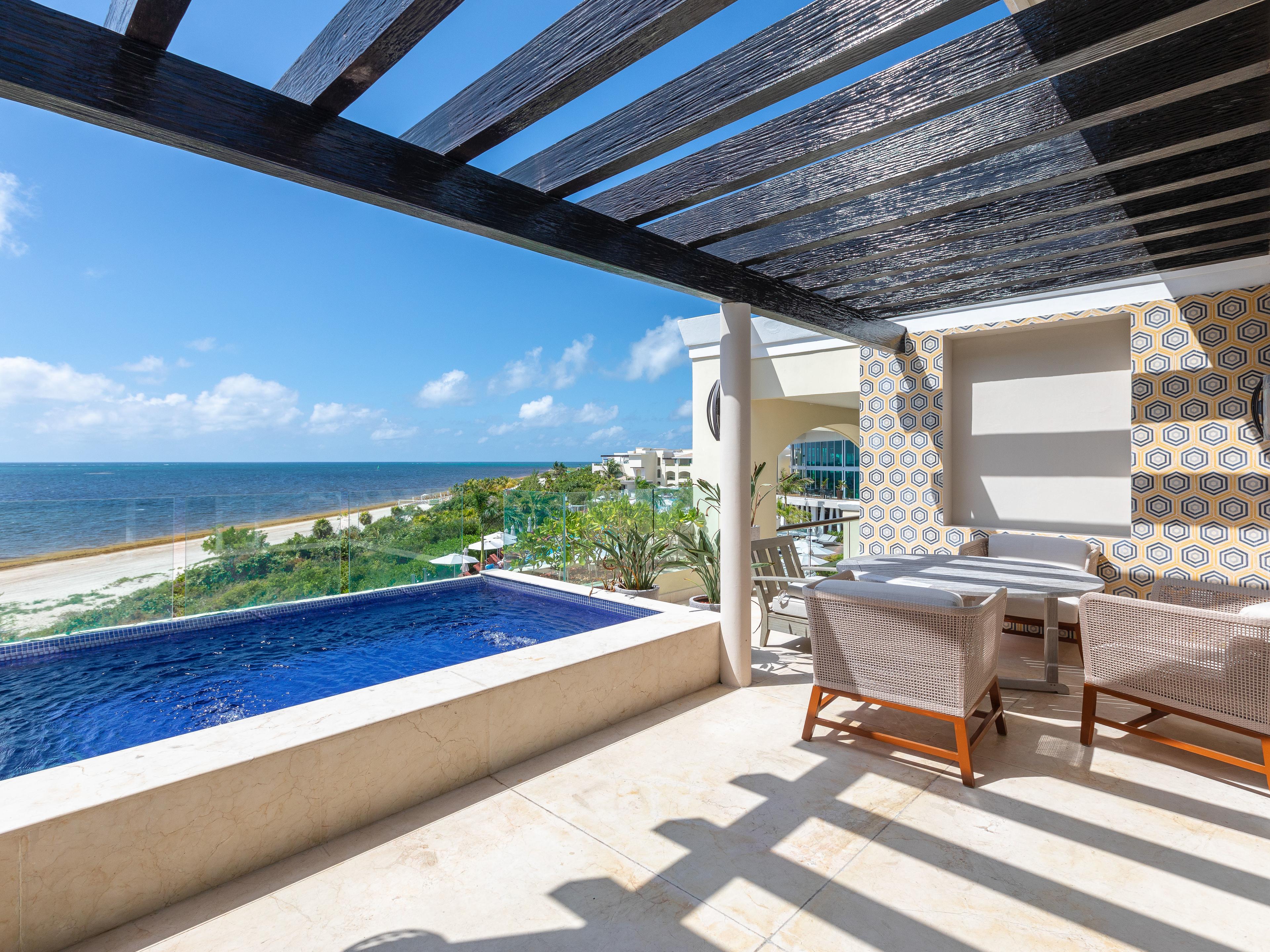 A private plunge pool and patio at a beach-front resort