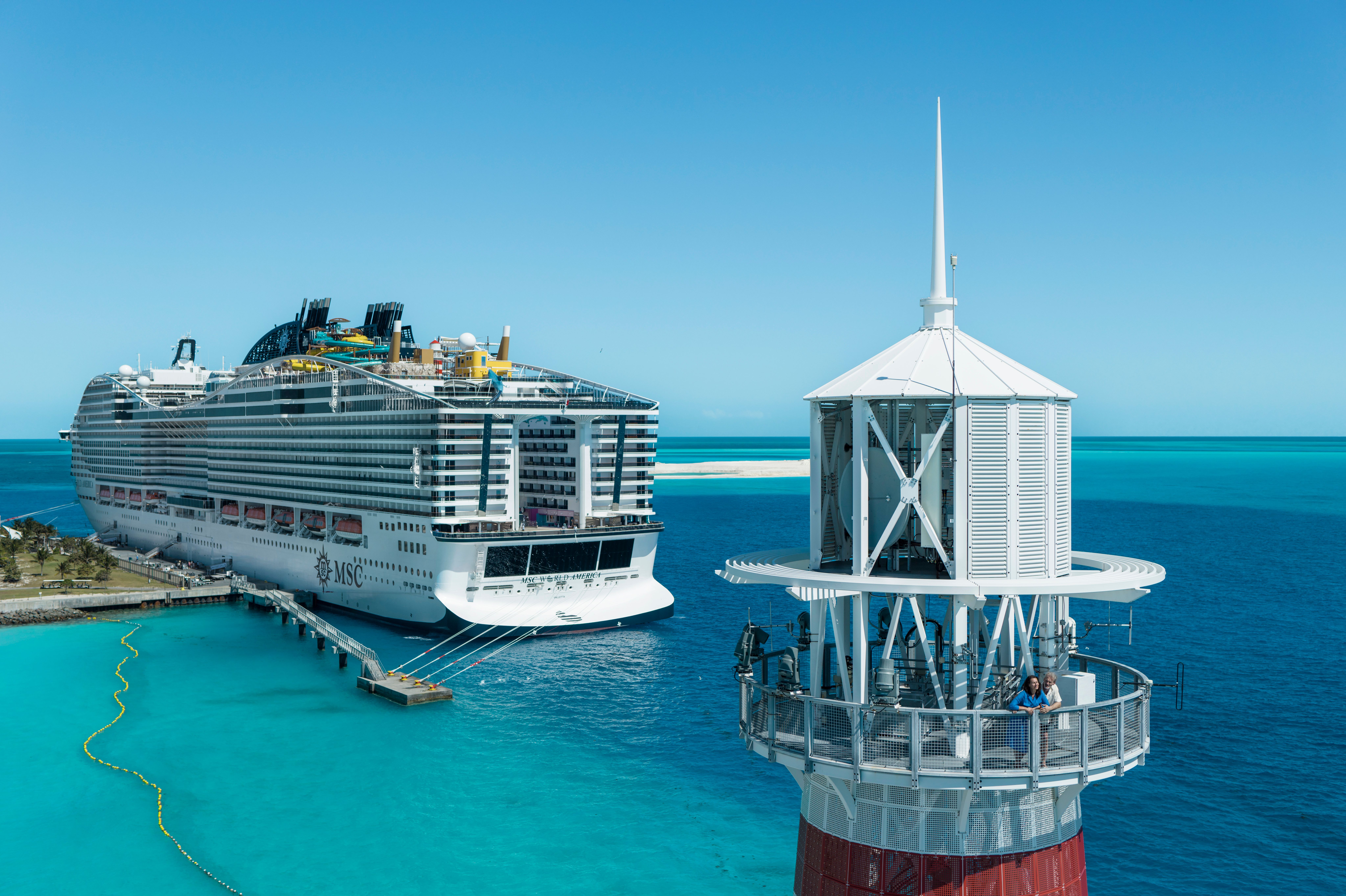 Lighthouse overlooking MSC cruise ship