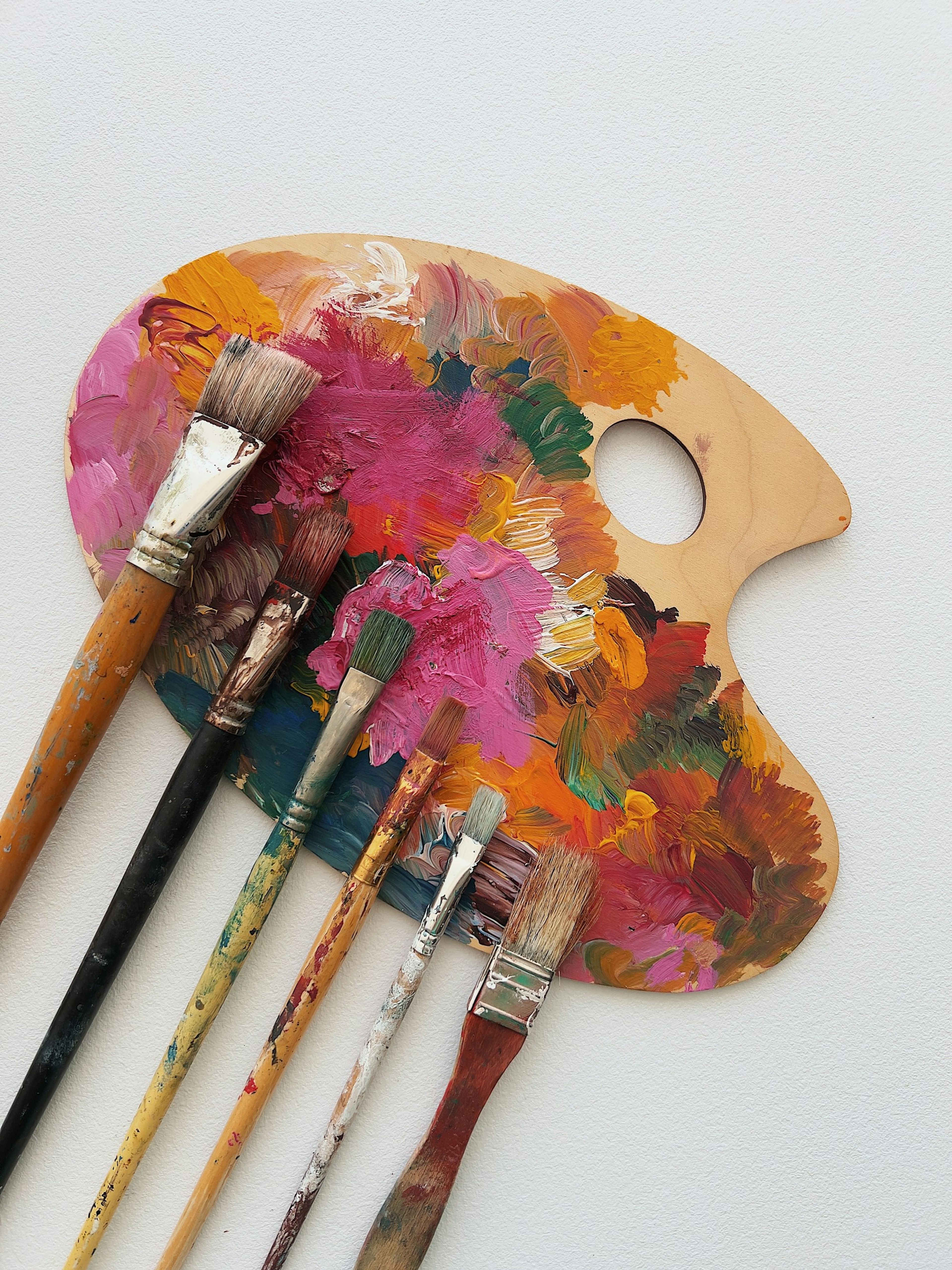 Paintbrushes on a colourful palette