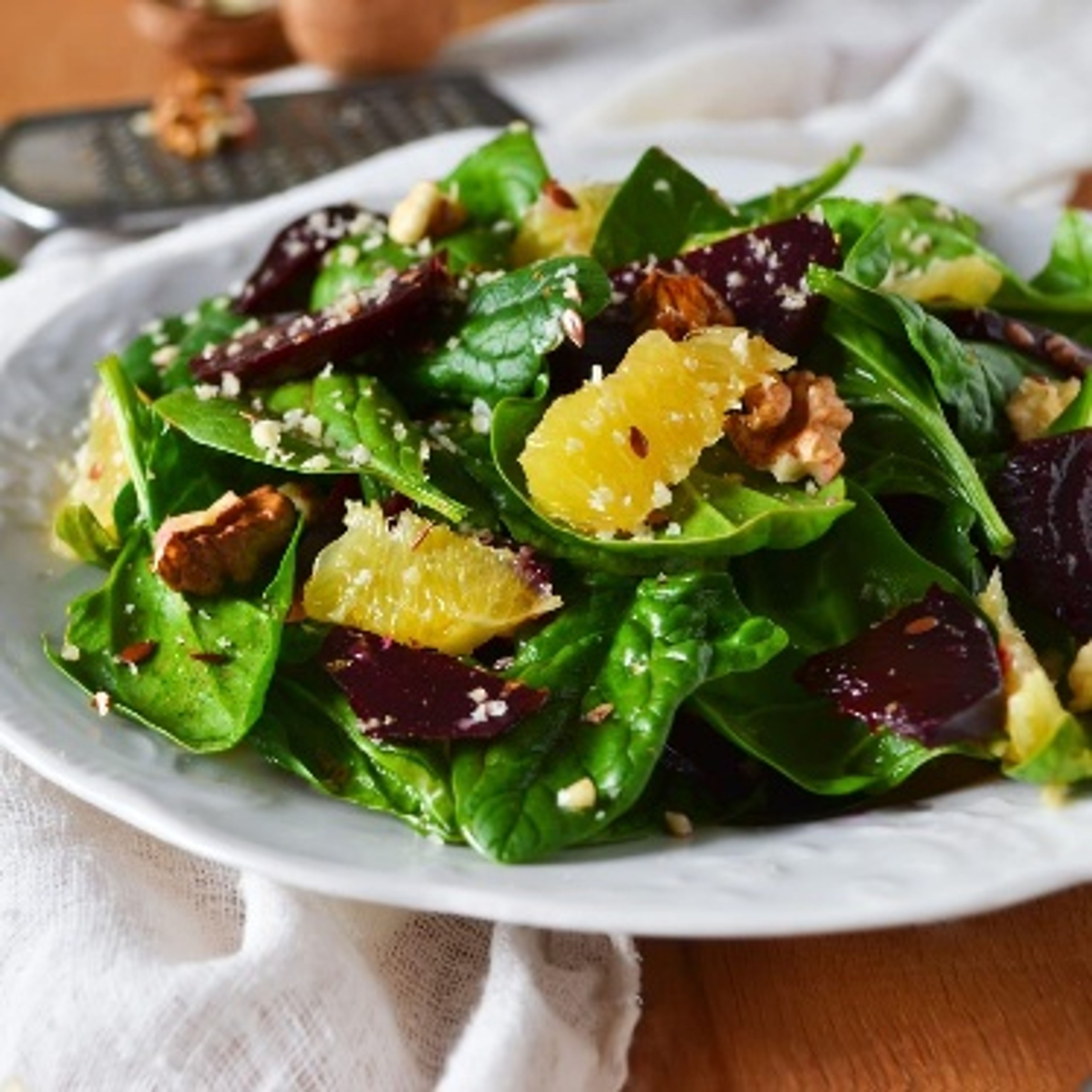 Beetroot, spinach and walnut salad with orange segments