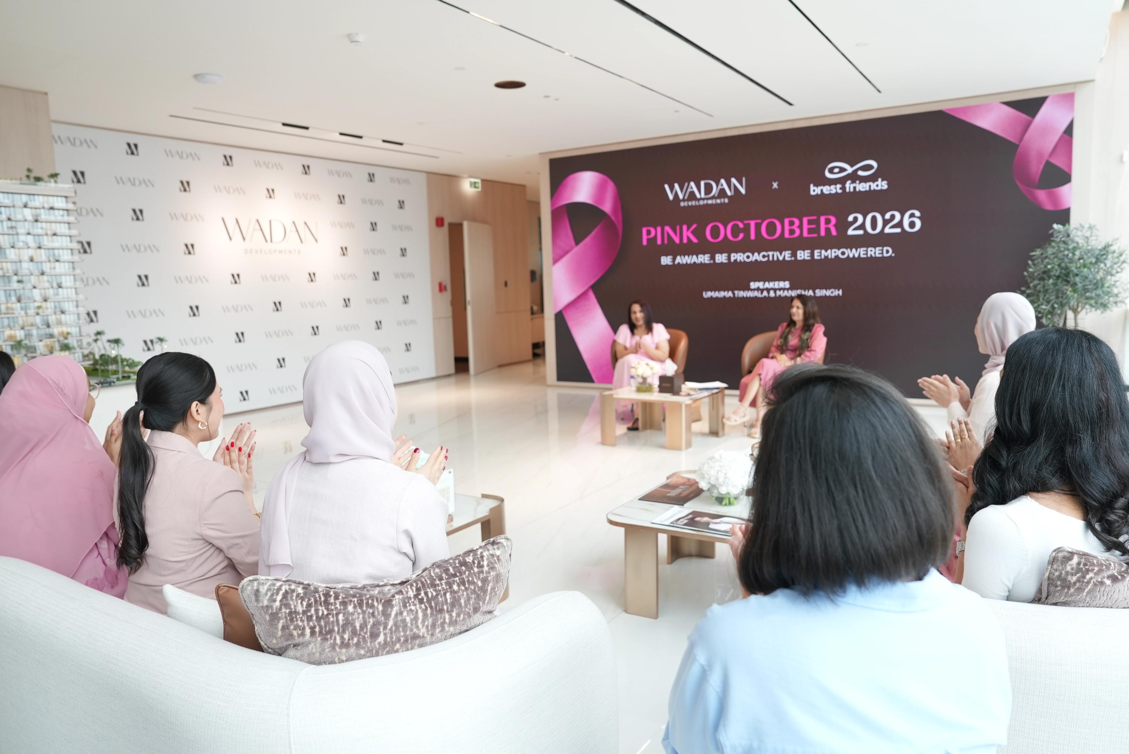 Guests applauding during the Pink October 2026 talk hosted by Wadan Developments and Brest Friends