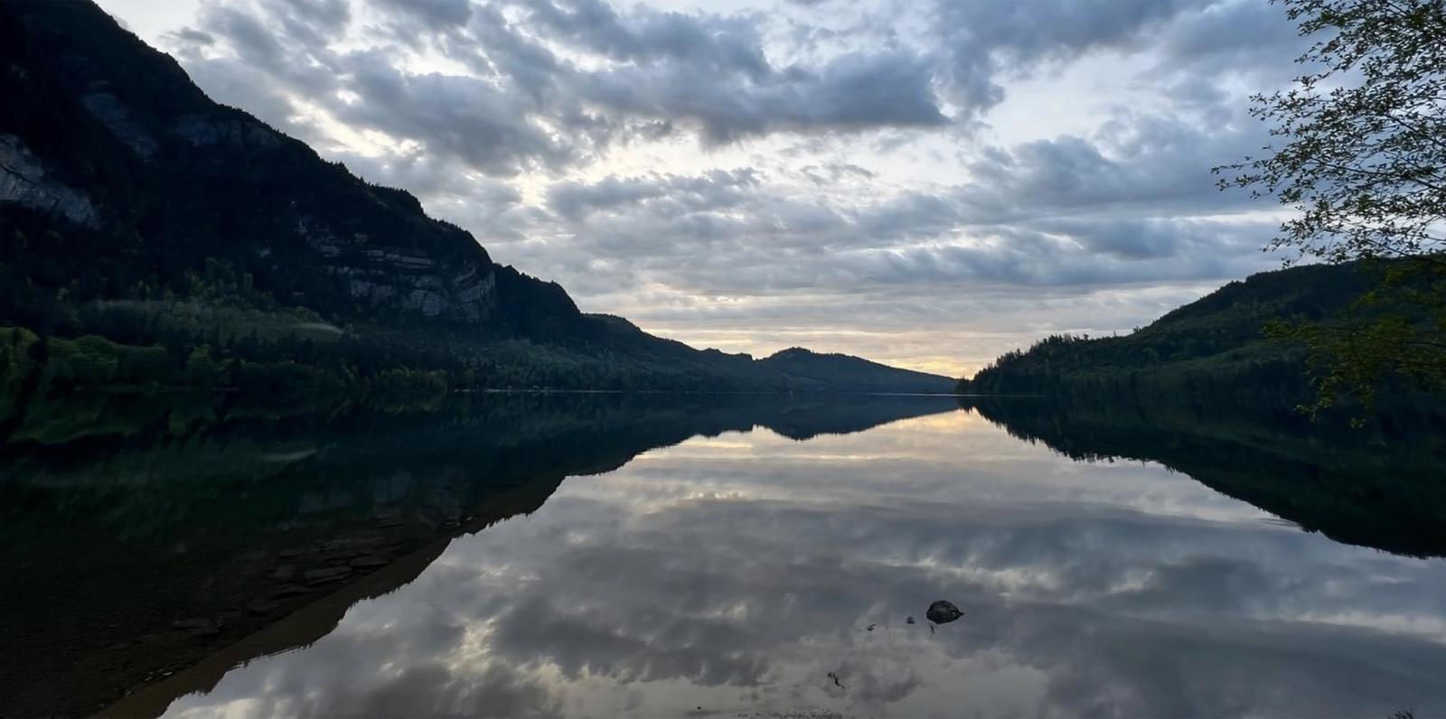 Dusk descending over a calm lake