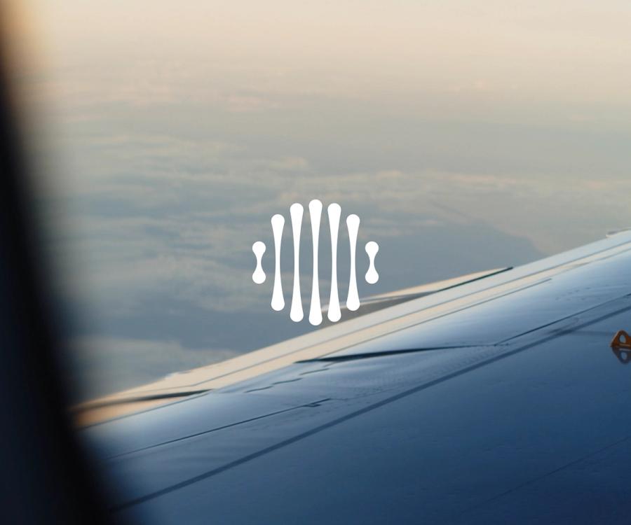 Image outside of a plain with illustrative logo in the center