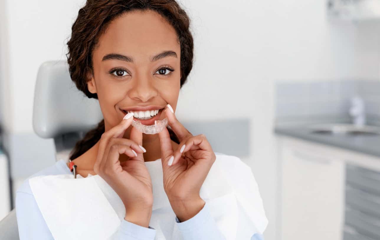 lady holding an invisalign