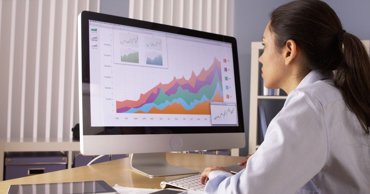 Female stock analyst looking at chart