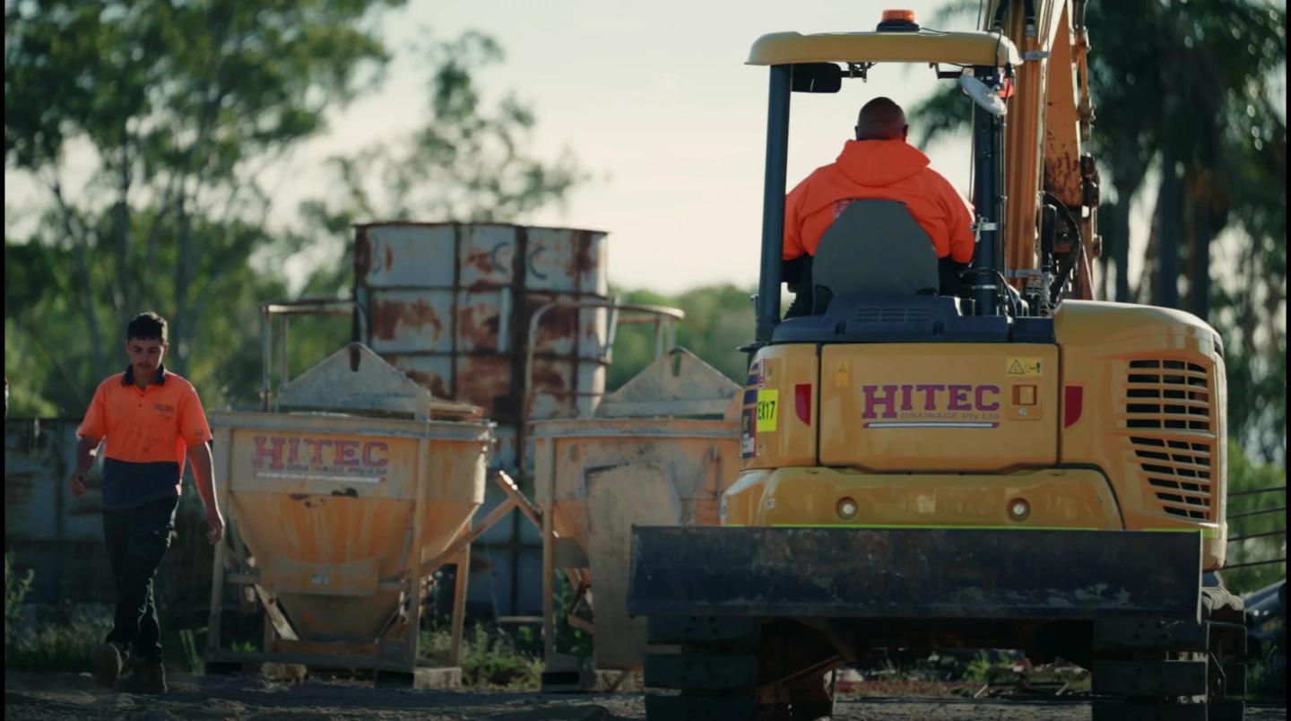 A Hitec Drainage excavator and concrete kibbles on site