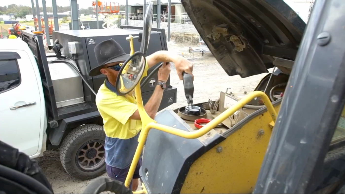Refuelling an excavator from a service truck on a civil project