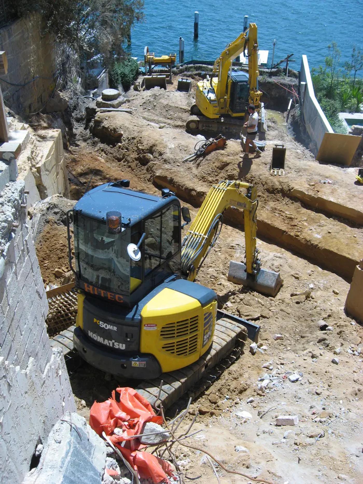 Hitec Drainage excavators working a waterfront excavation site