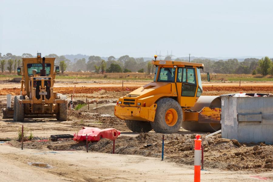 A civil construction site at sunrise