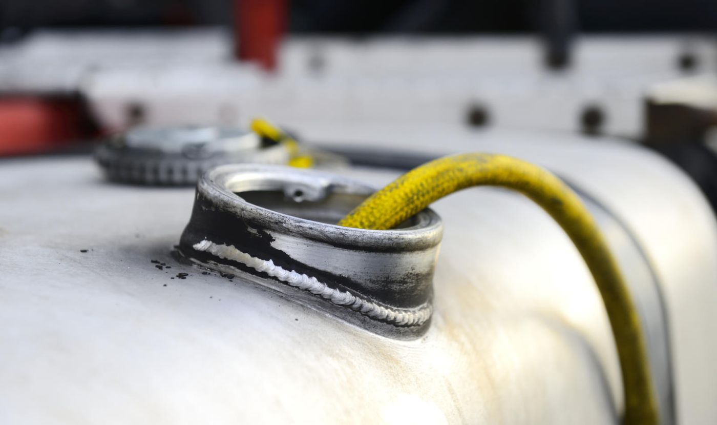 A hose in the filler neck of a truck fuel tank