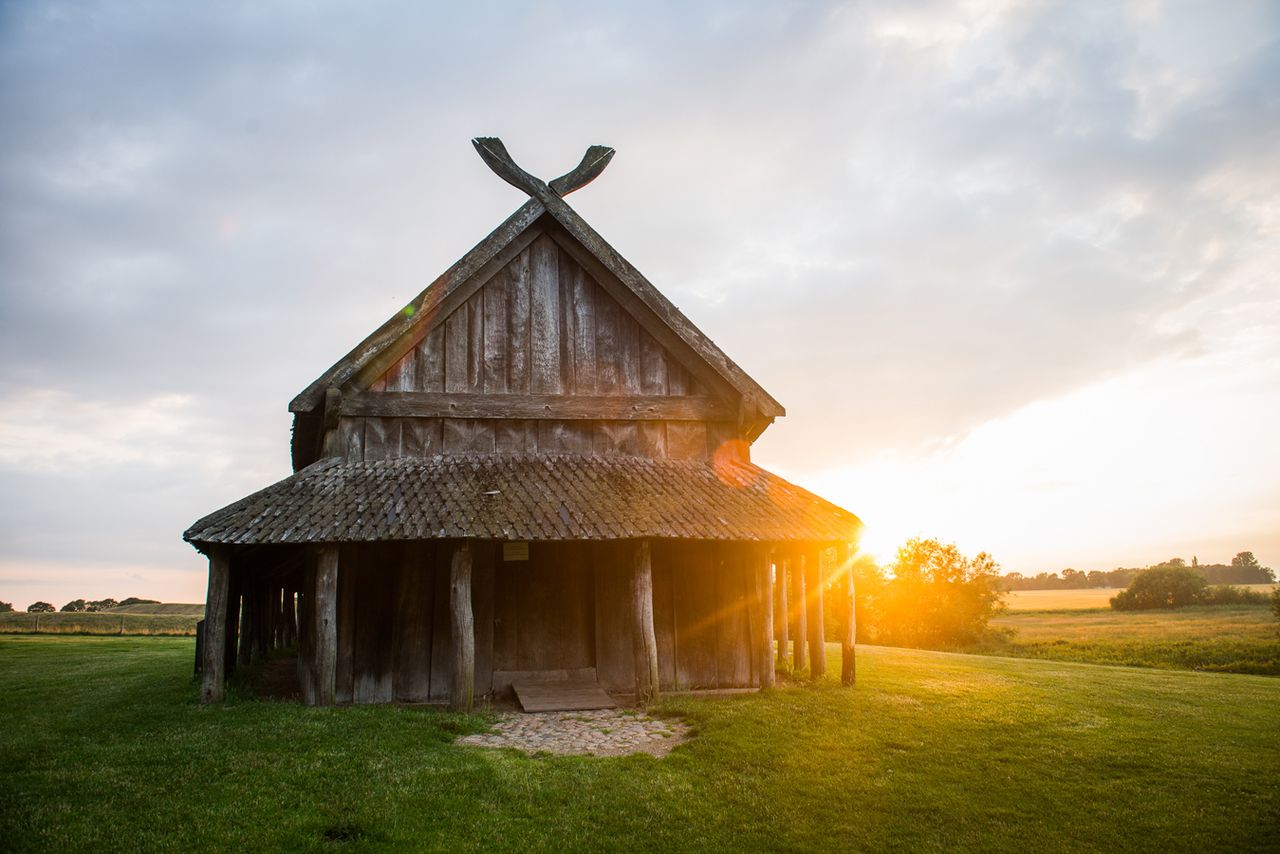 The sun rises behind Langhuset
