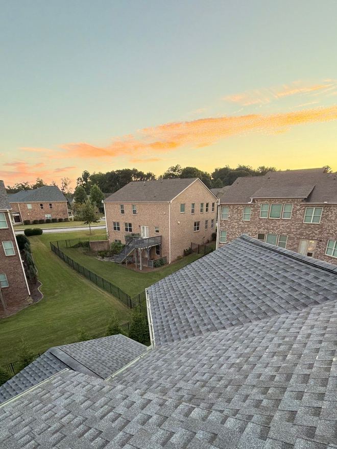 Sunrise over a metro Atlanta subdivision, seen from a newly shingled roof