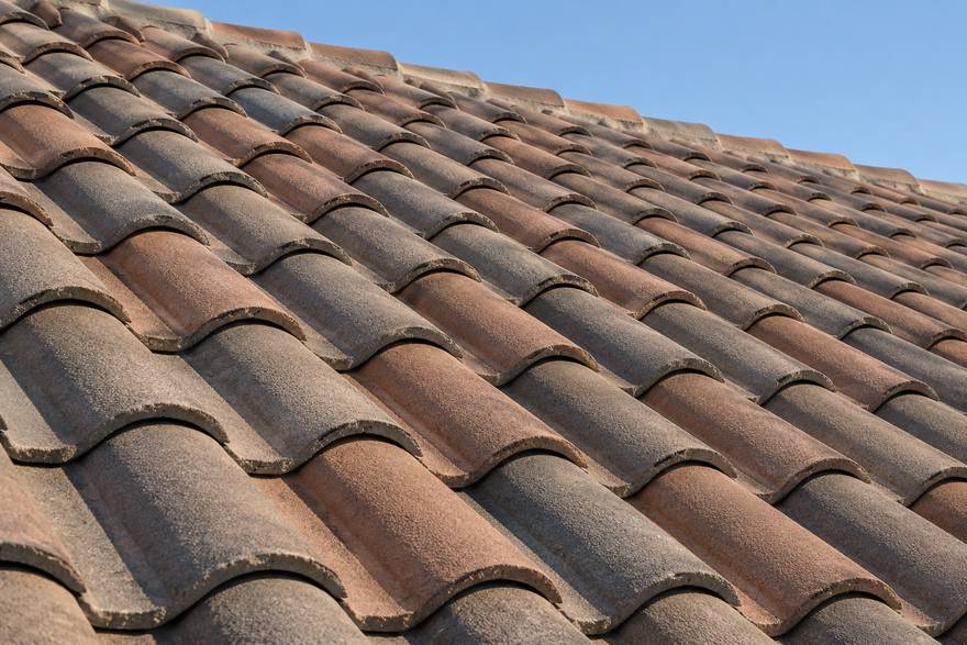 Concrete barrel tile roof in a terracotta and grey blend