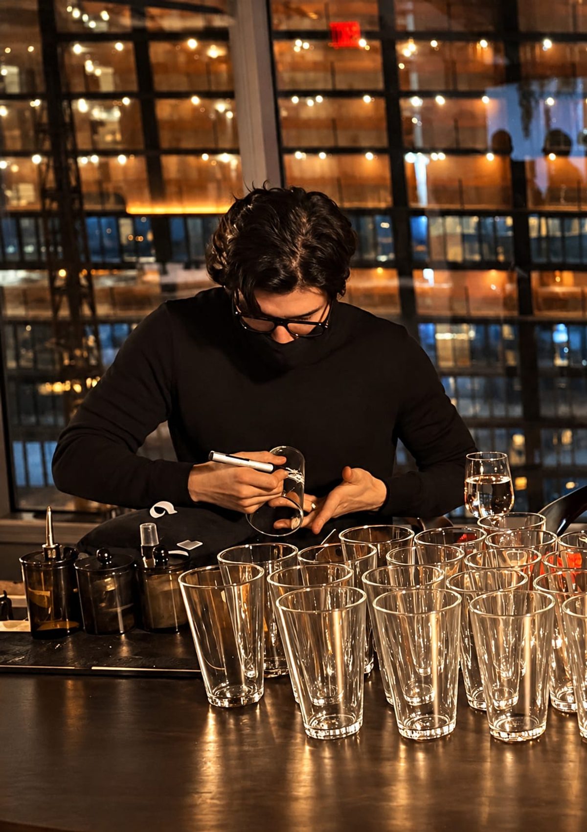 Rodolfo engraving glasses at a live event