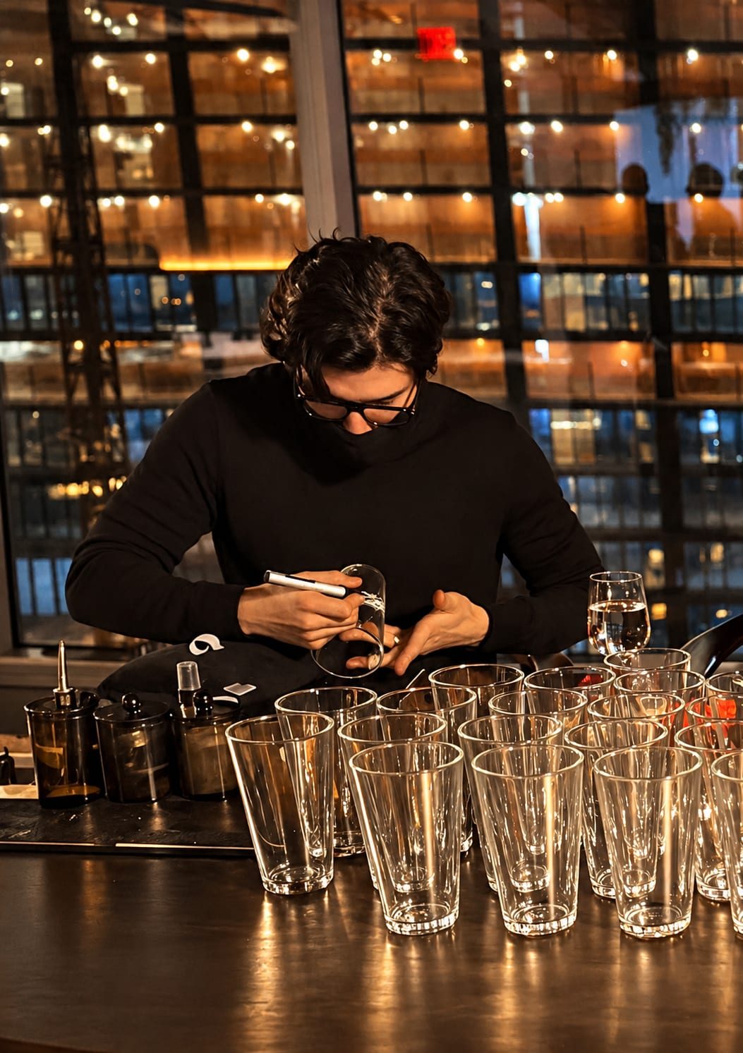 Rodolfo engraving glasses at a live event