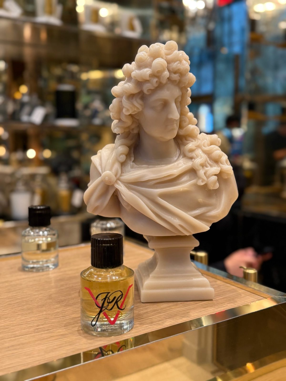 A personalized fragrance bottle in its event setting