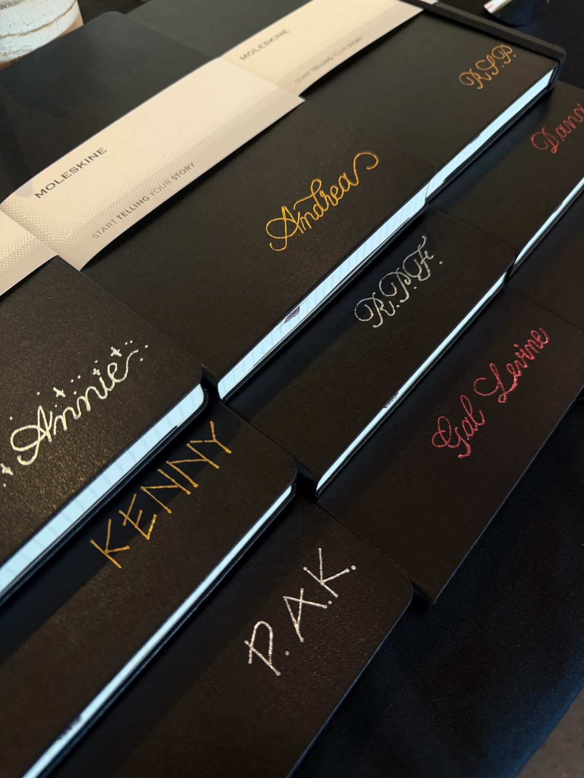 Custom hand lettering on a notebook cover