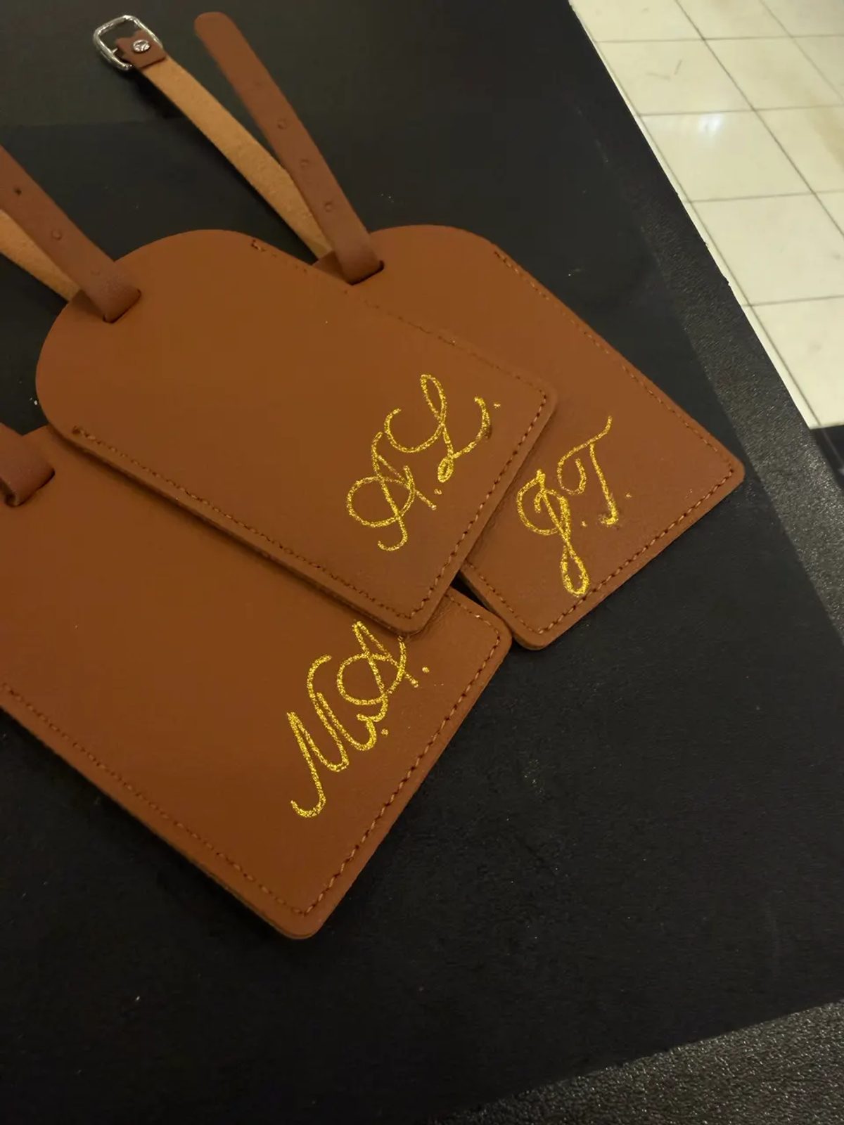 Metallic initials on leather tags