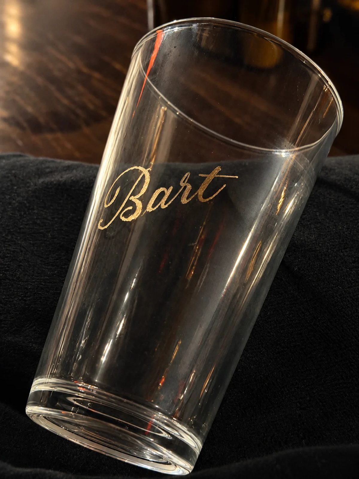 Hand-engraved lettering on a drinking glass