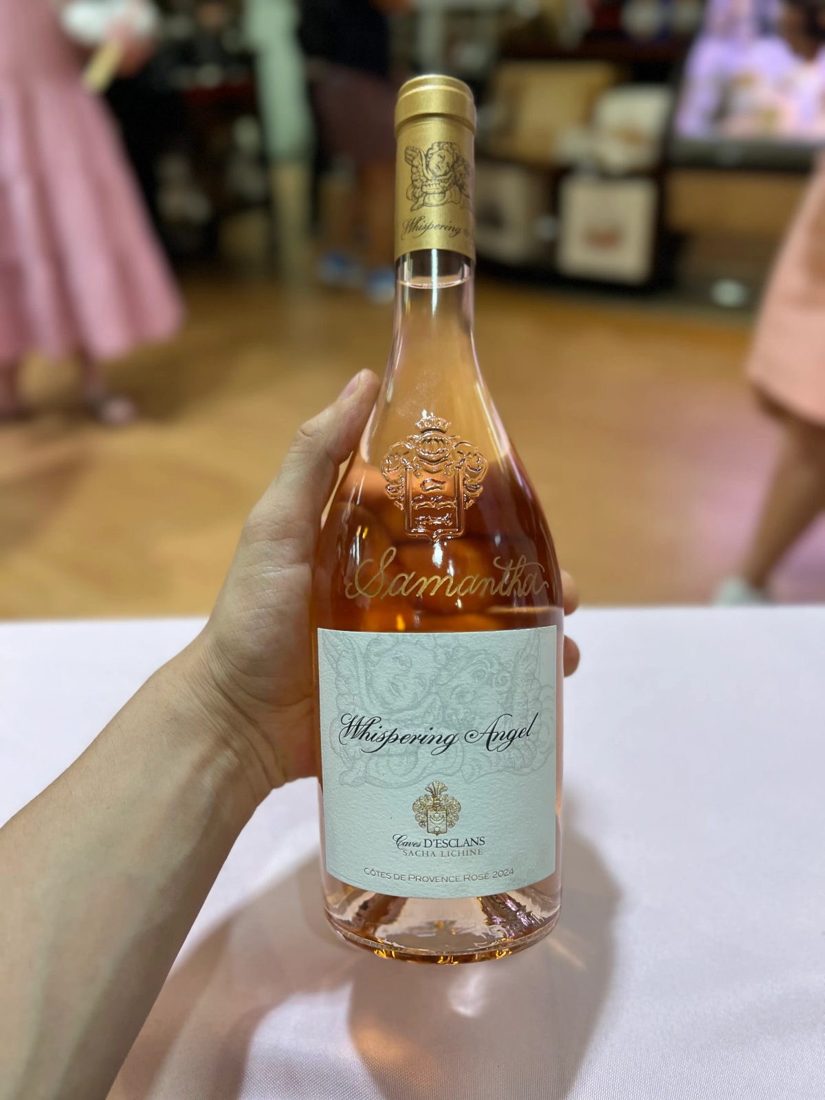 Wine bottle personalized with engraved lettering and decorative detail