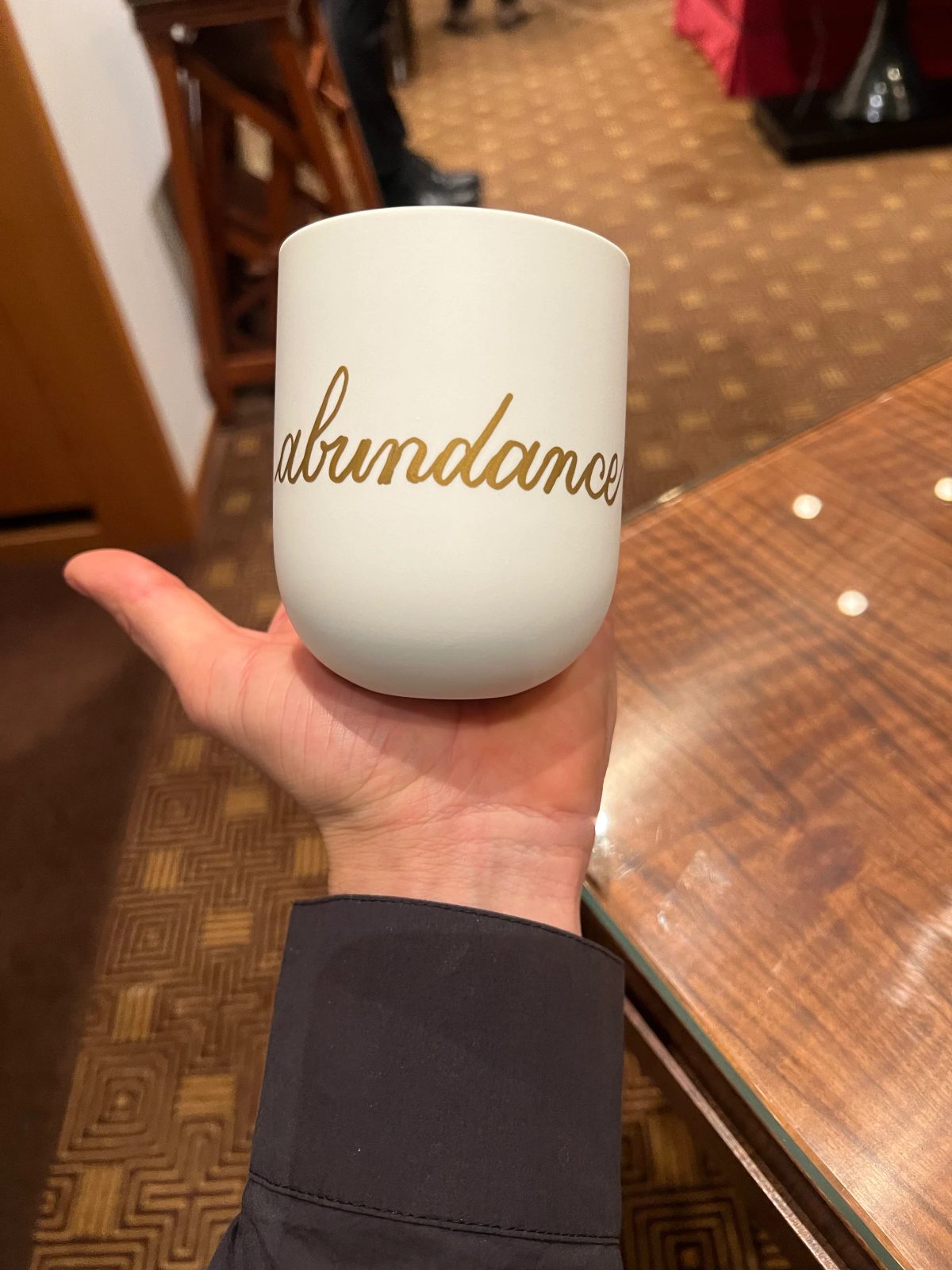 Personalized ceramic cup with hand-drawn lettering or illustration