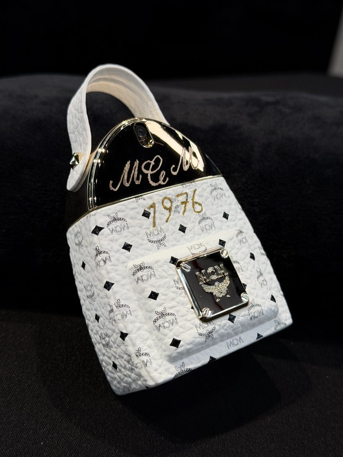 Hand-painted lettering and motifs on leather goods