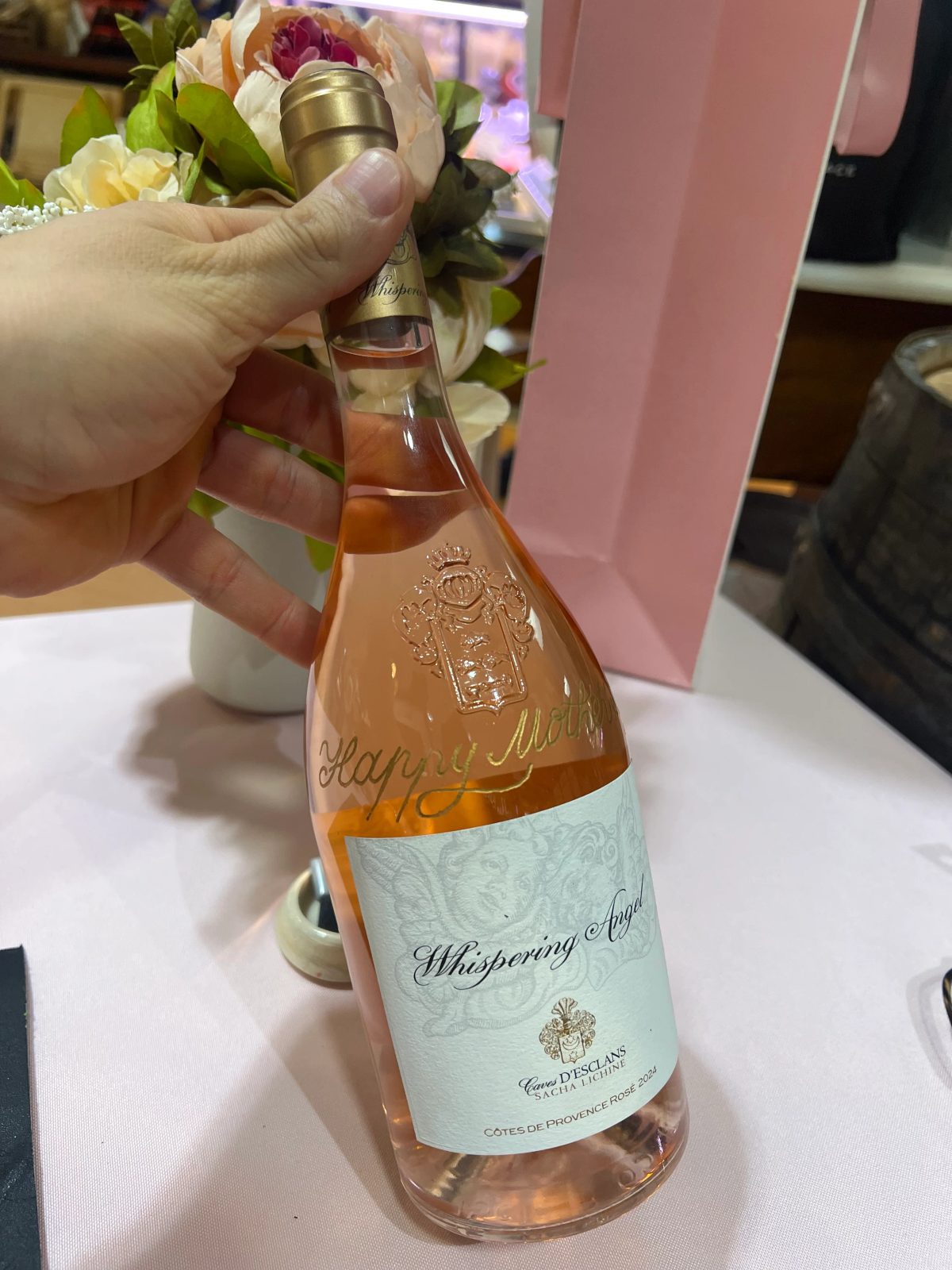 Wine bottle personalized with engraved lettering and decorative detail