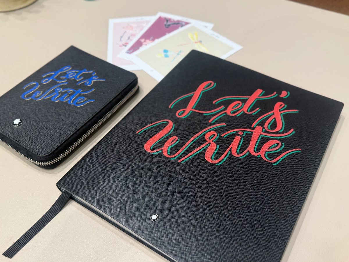 Custom hand lettering on a notebook cover