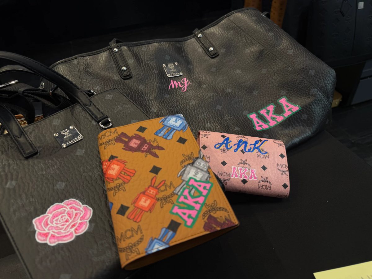 Hand-painted lettering and motifs on leather goods