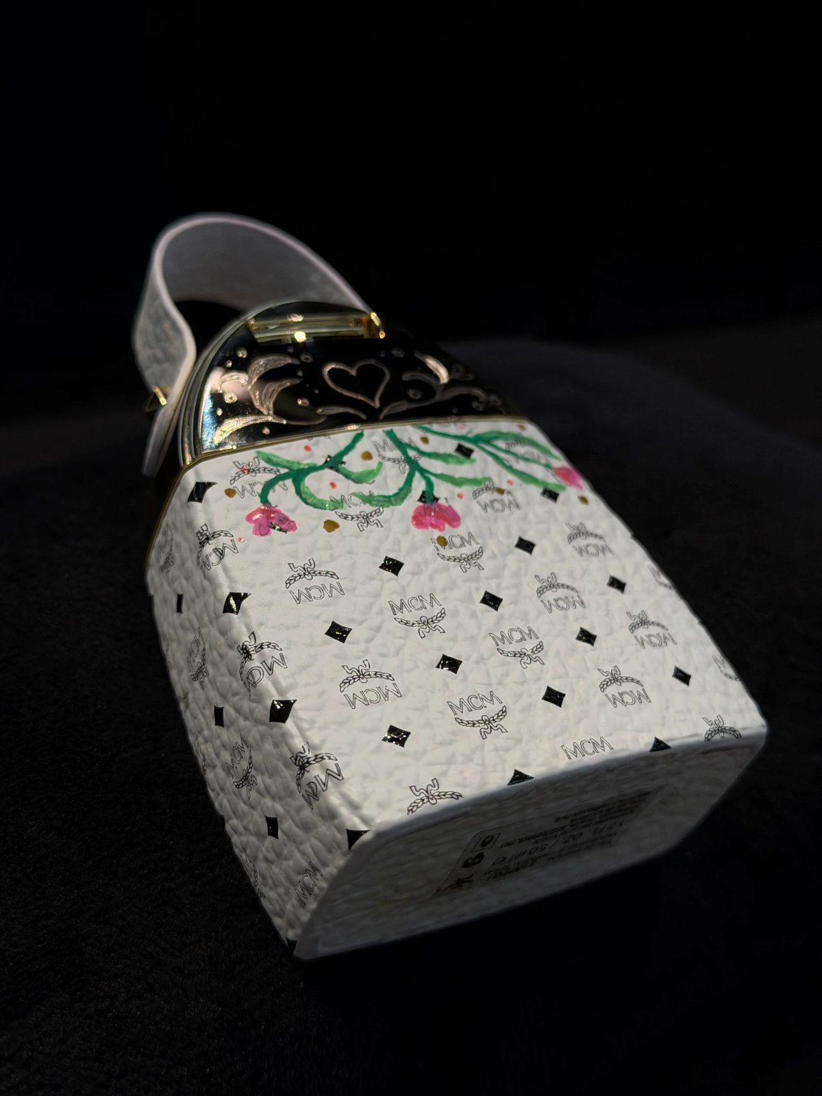 Hand-painted lettering and motifs on leather goods