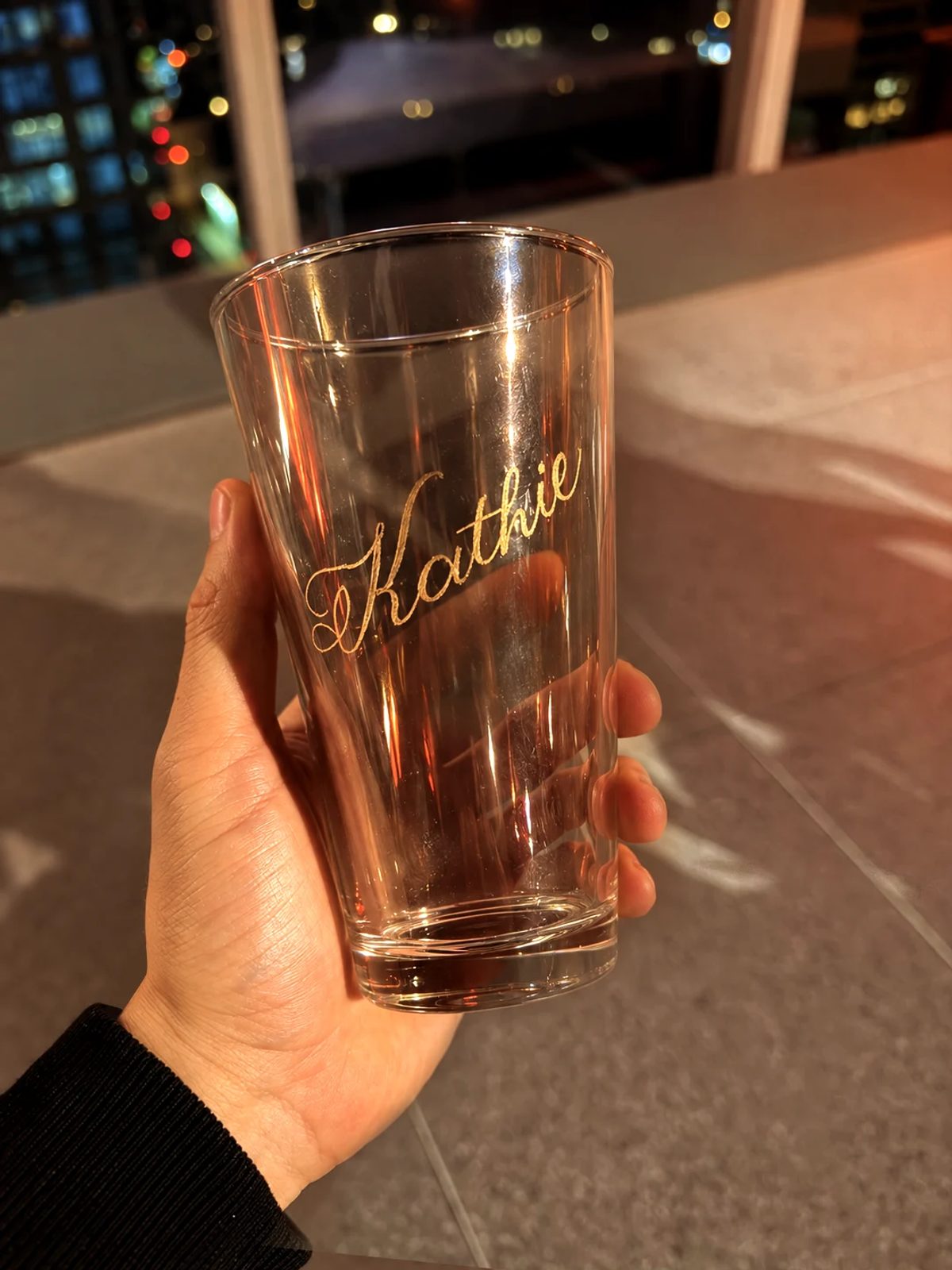 Hand-engraved lettering on a drinking glass