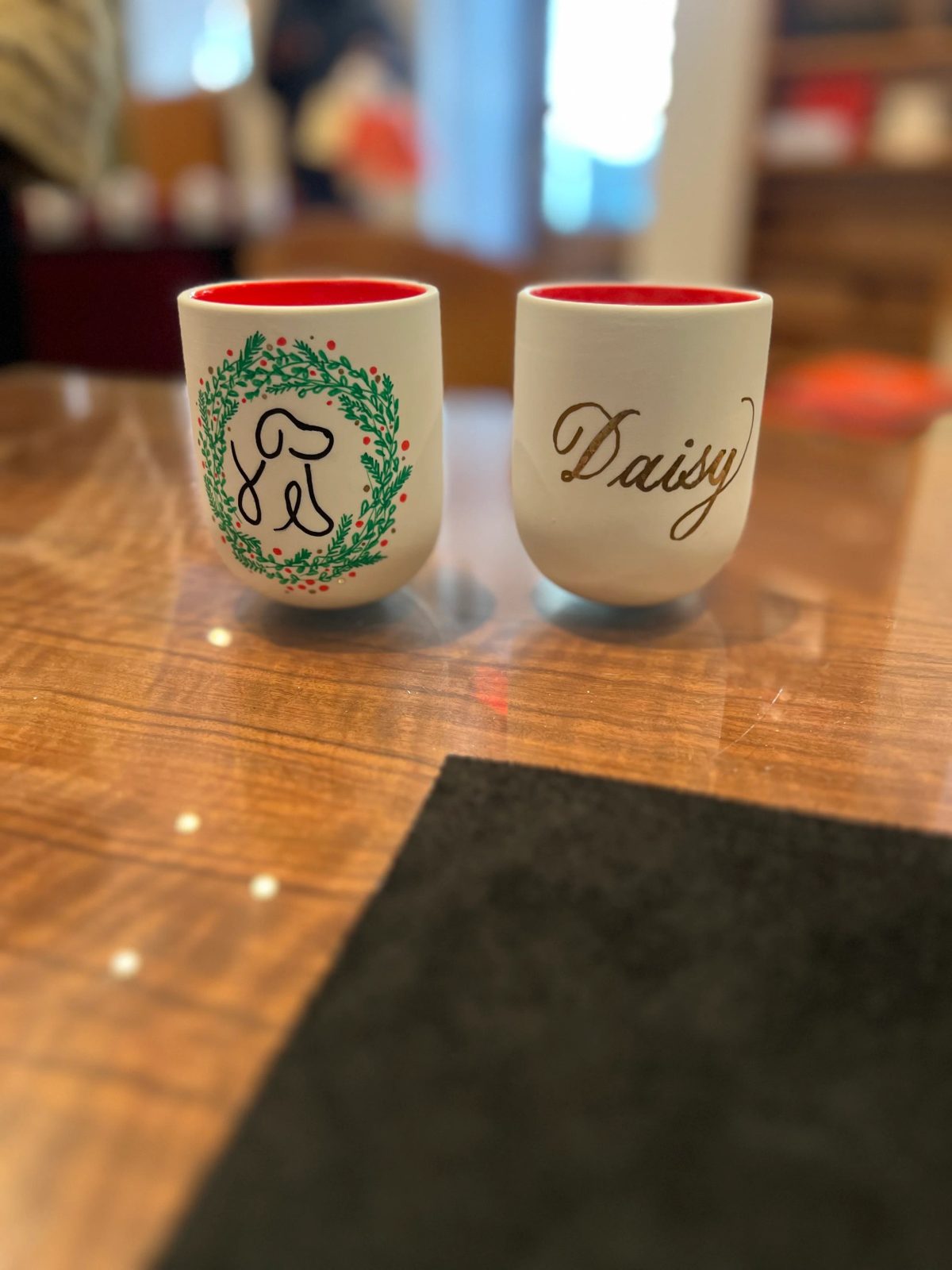 Personalized ceramic cup with hand-drawn lettering or illustration