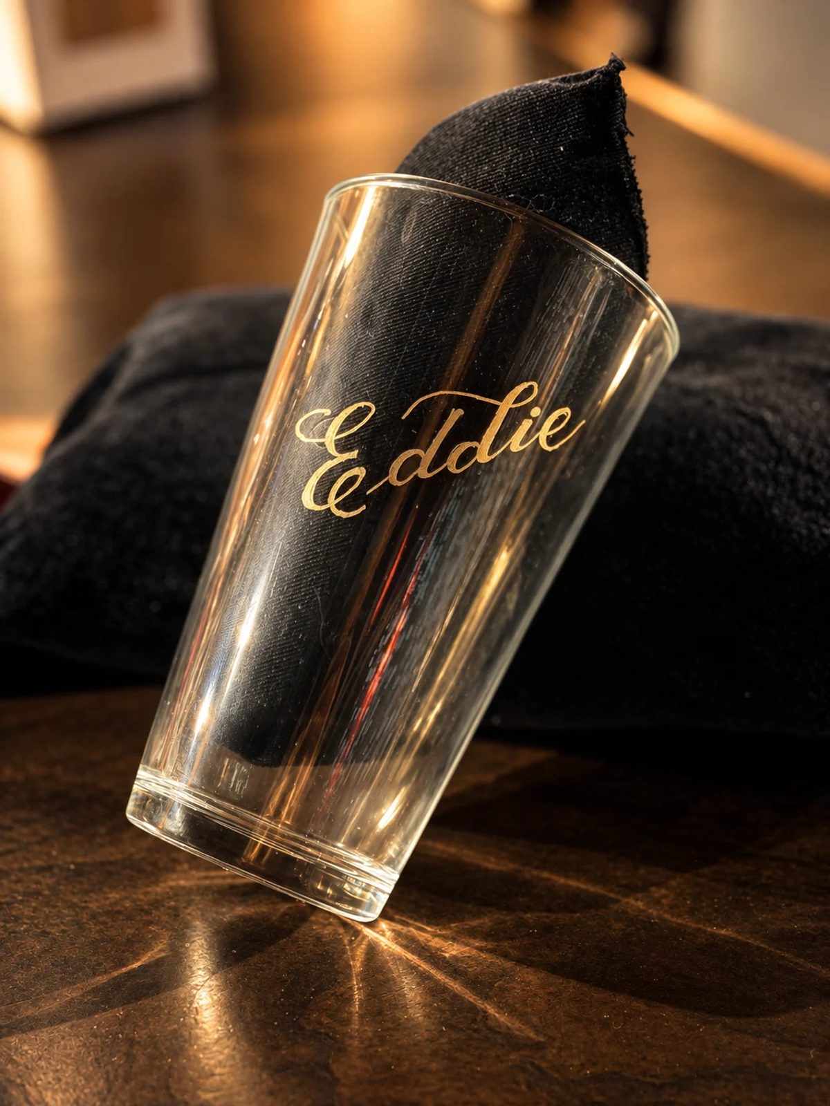 Hand-engraved lettering on a drinking glass