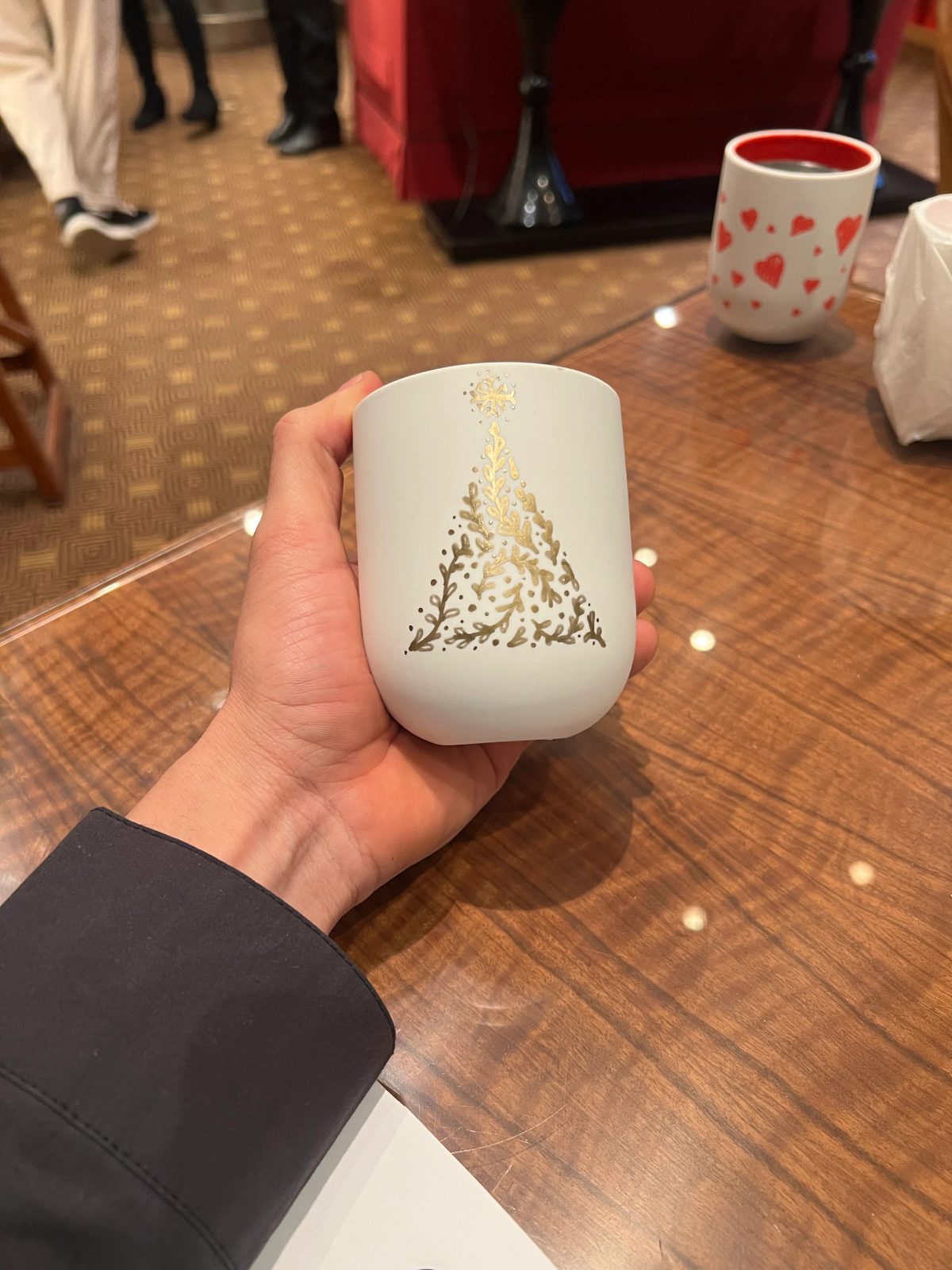 Personalized ceramic cup with hand-drawn lettering or illustration