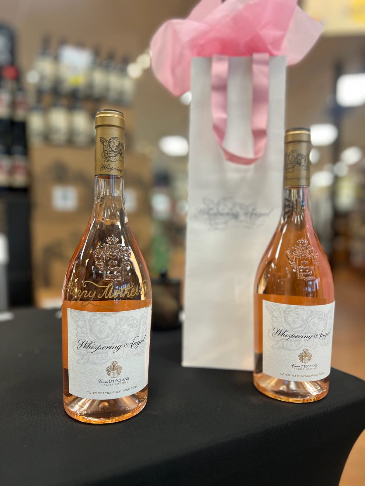 Wine bottle personalized with engraved lettering and decorative detail