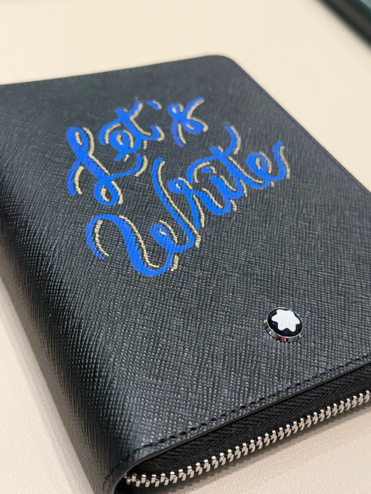 Custom hand lettering on a notebook cover