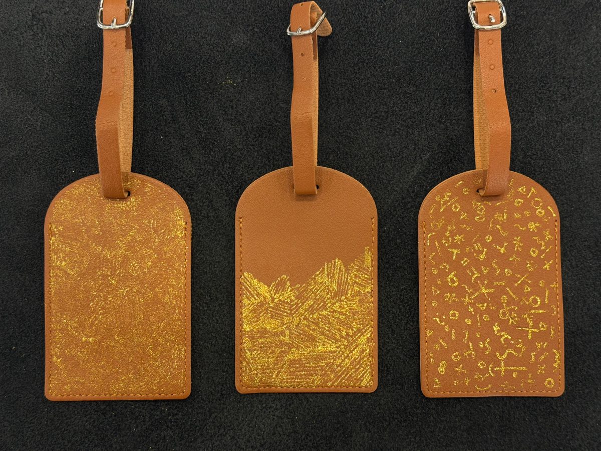 Metallic personalization on a leather accessory