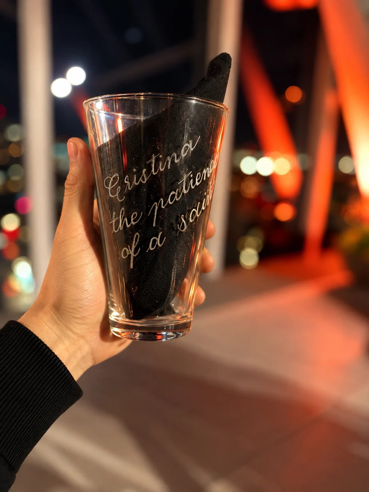 Hand-engraved lettering on a drinking glass